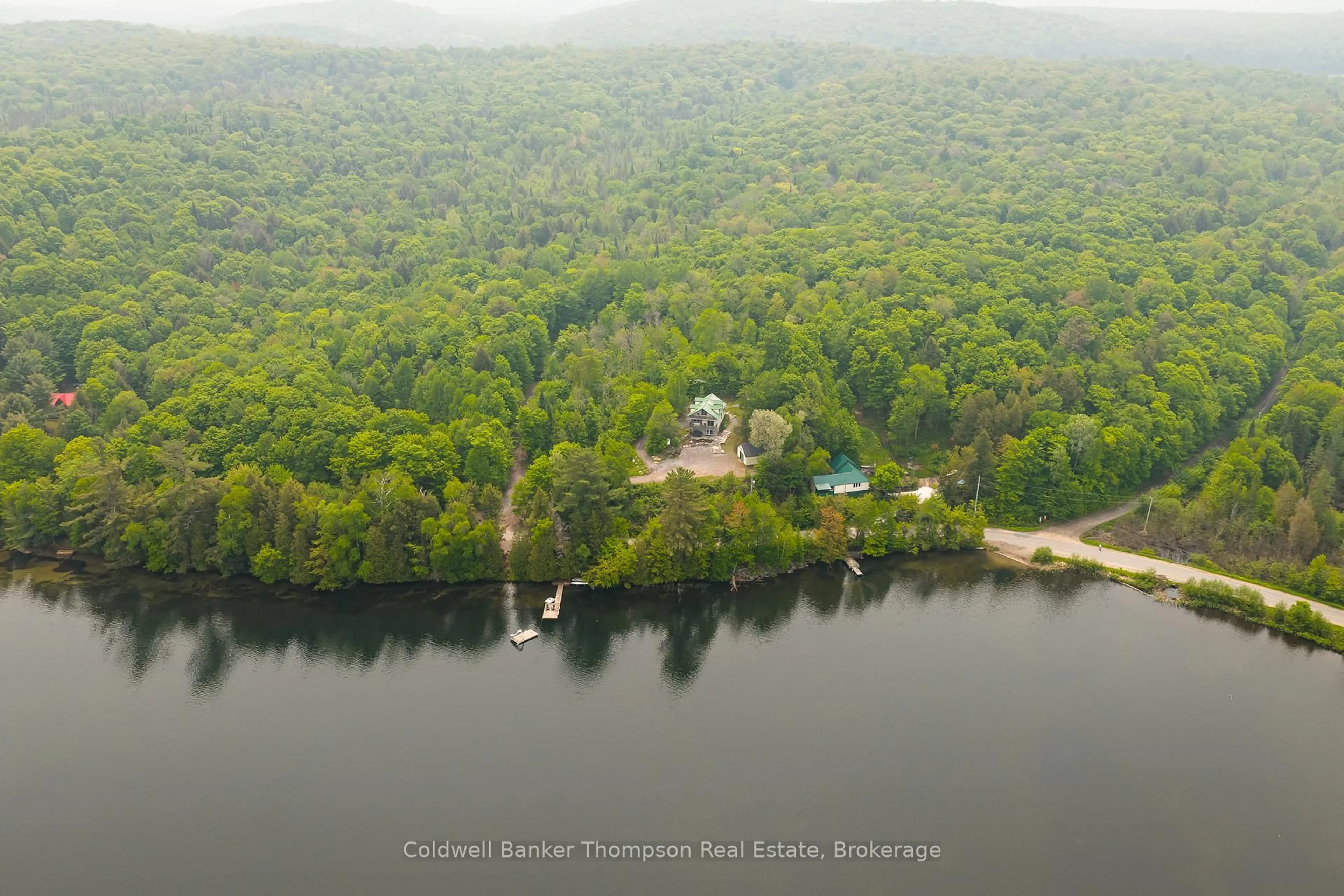 A pic from outside/outdoor area/front of a property/back of a property/a pic from drone, water/lake/river/ocean view for 879 Three Mile Lake Rd, Armour Ontario P0A 1L0