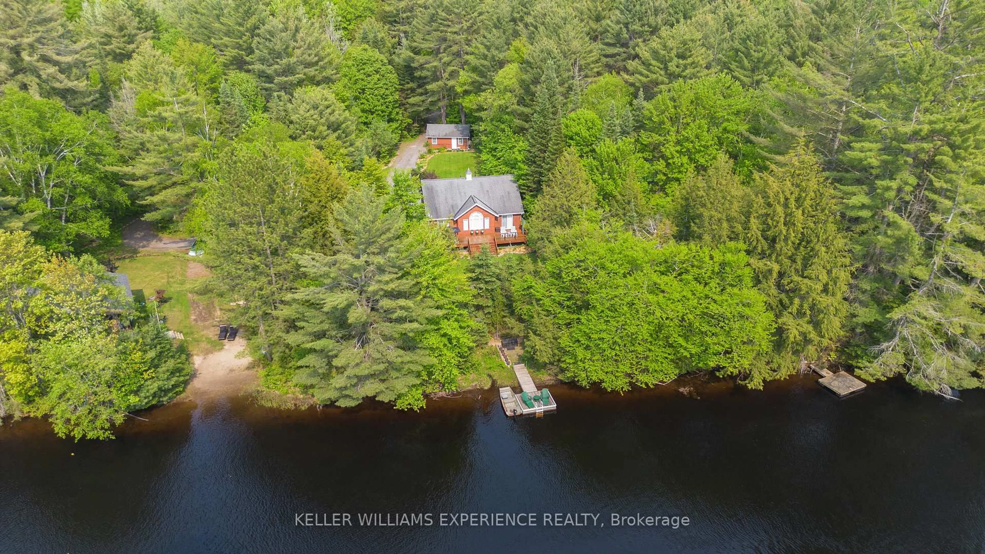 A pic from outside/outdoor area/front of a property/back of a property/a pic from drone, water/lake/river/ocean view for 1065 Forrester Tr, Bracebridge Ontario P1L 1W9