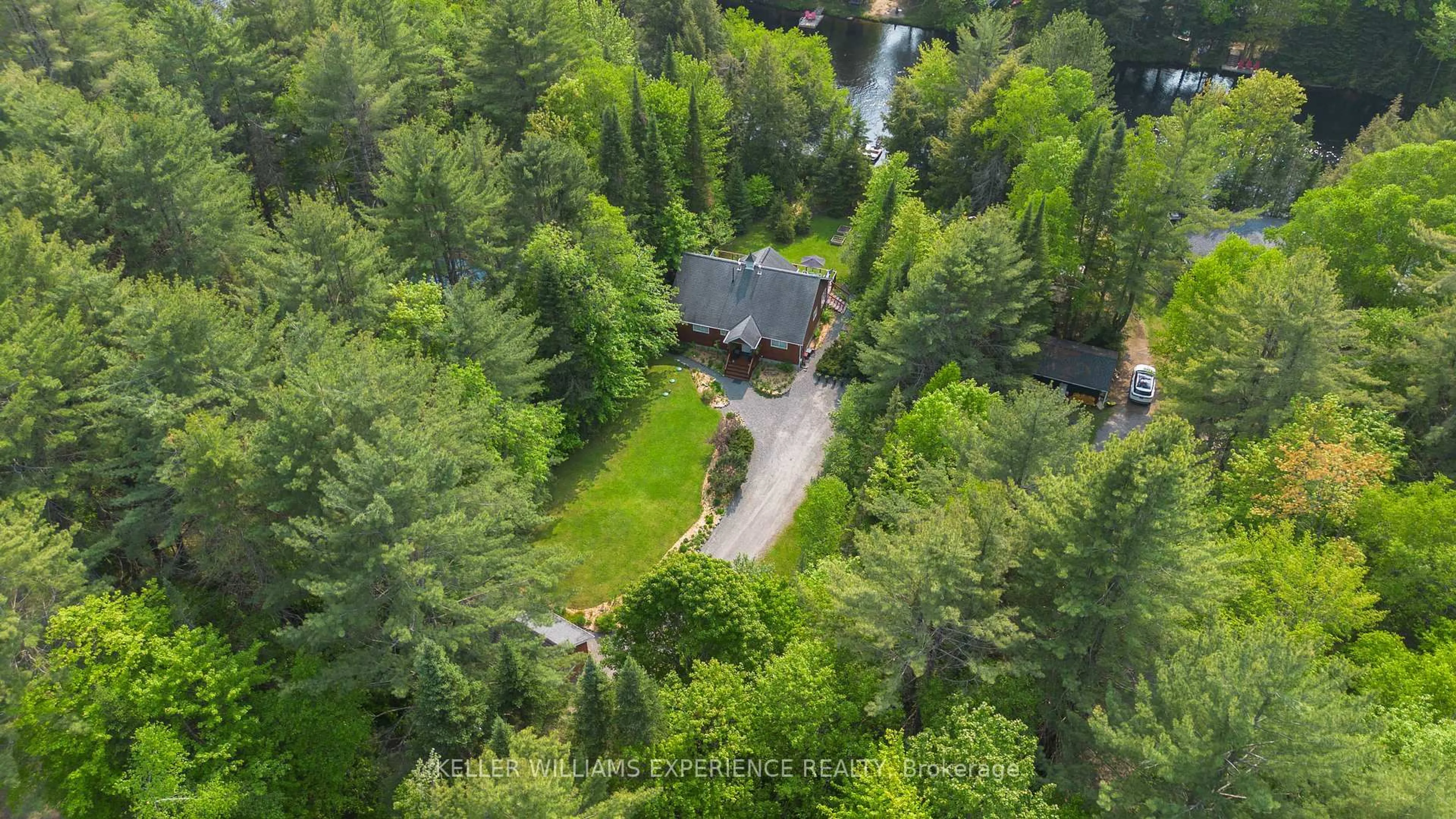 A pic from outside/outdoor area/front of a property/back of a property/a pic from drone, forest/trees view for 1065 Forrester Tr, Bracebridge Ontario P1L 1W9