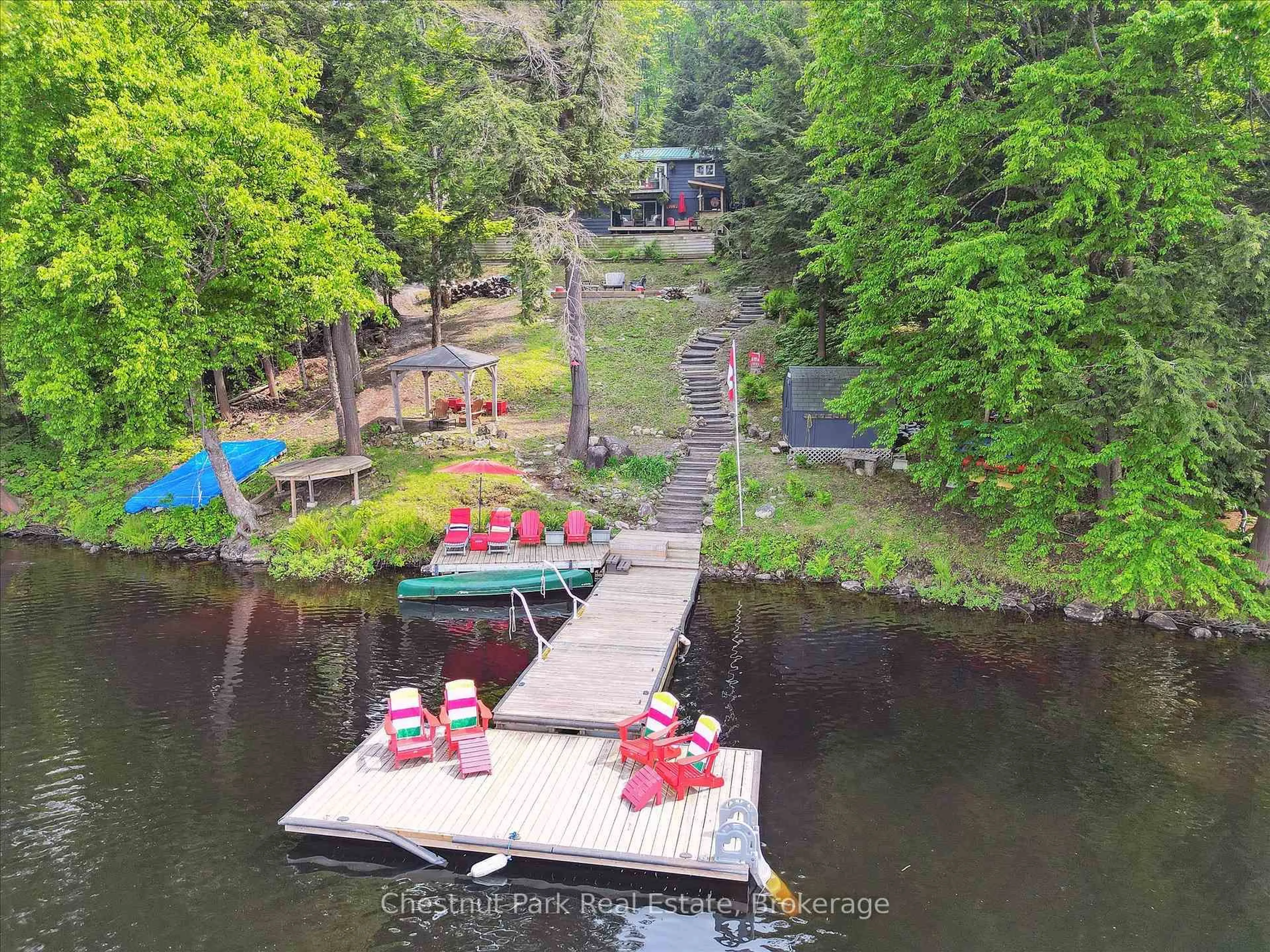 A pic from outside/outdoor area/front of a property/back of a property/a pic from drone, water/lake/river/ocean view for 218 North Dr, Huntsville Ontario P1H 2J2