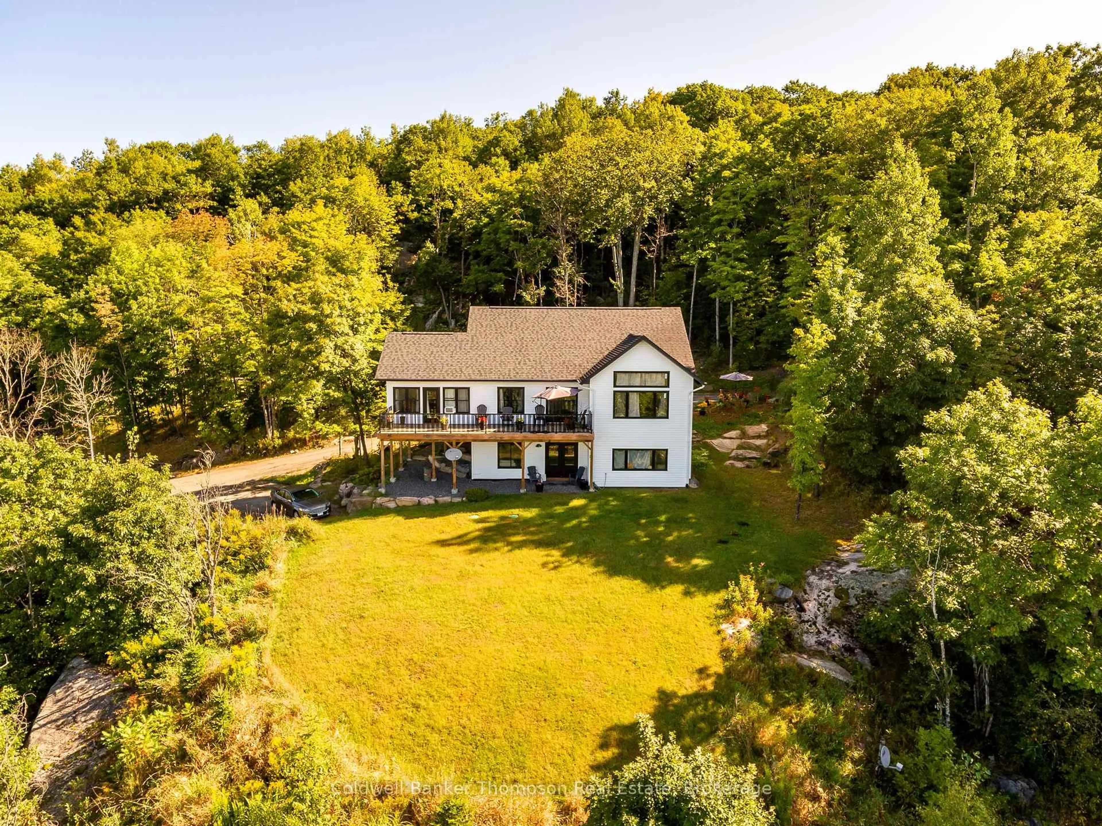 A pic from outside/outdoor area/front of a property/back of a property/a pic from drone, water/lake/river/ocean view for 467 Clearwater Lake Rd, Huntsville Ontario P0B 1L0