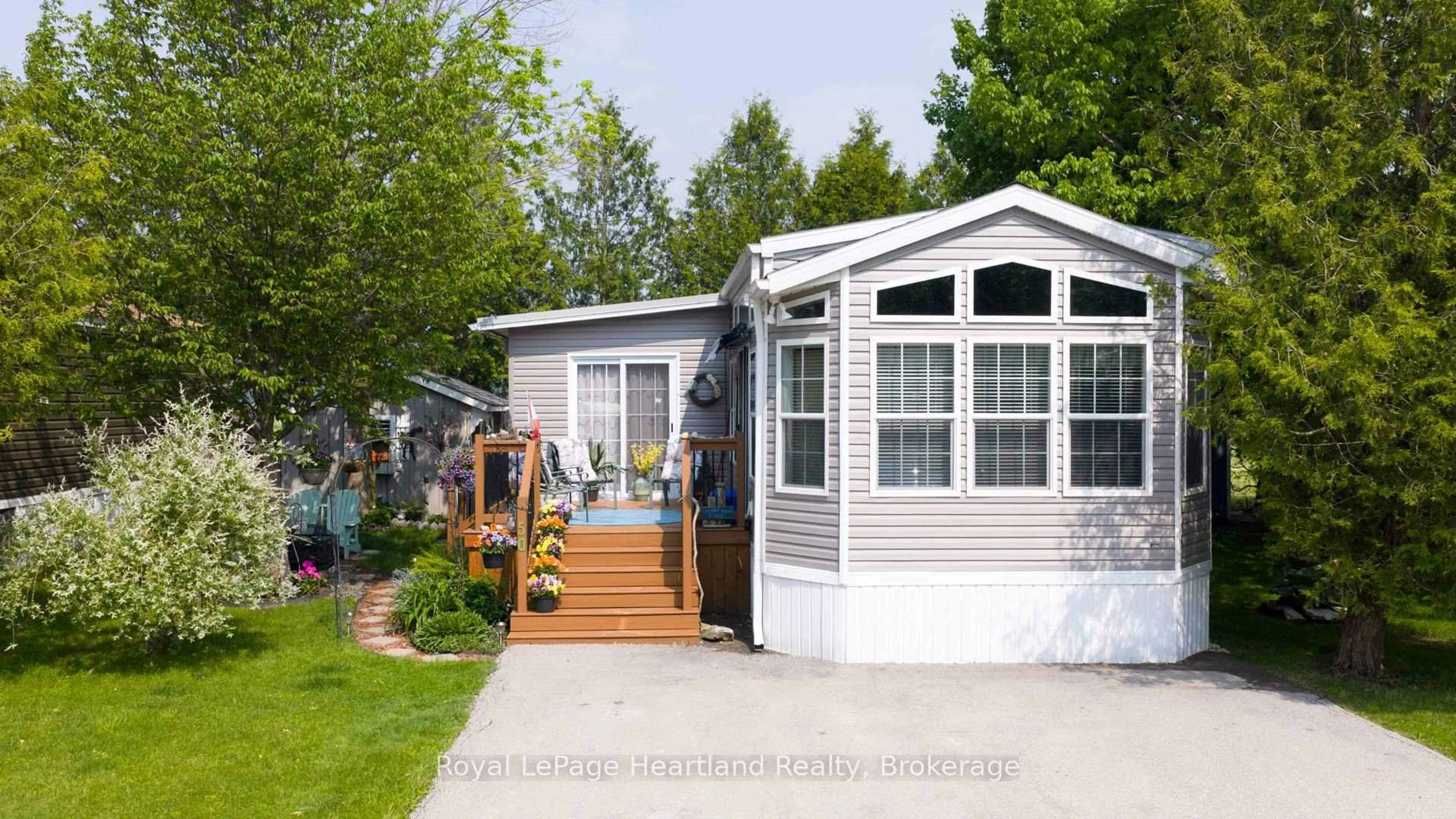 Home with vinyl exterior material, street for 77719 Bluewater Highway #50 Portside Drive, Central Huron Ontario N0M 1G0