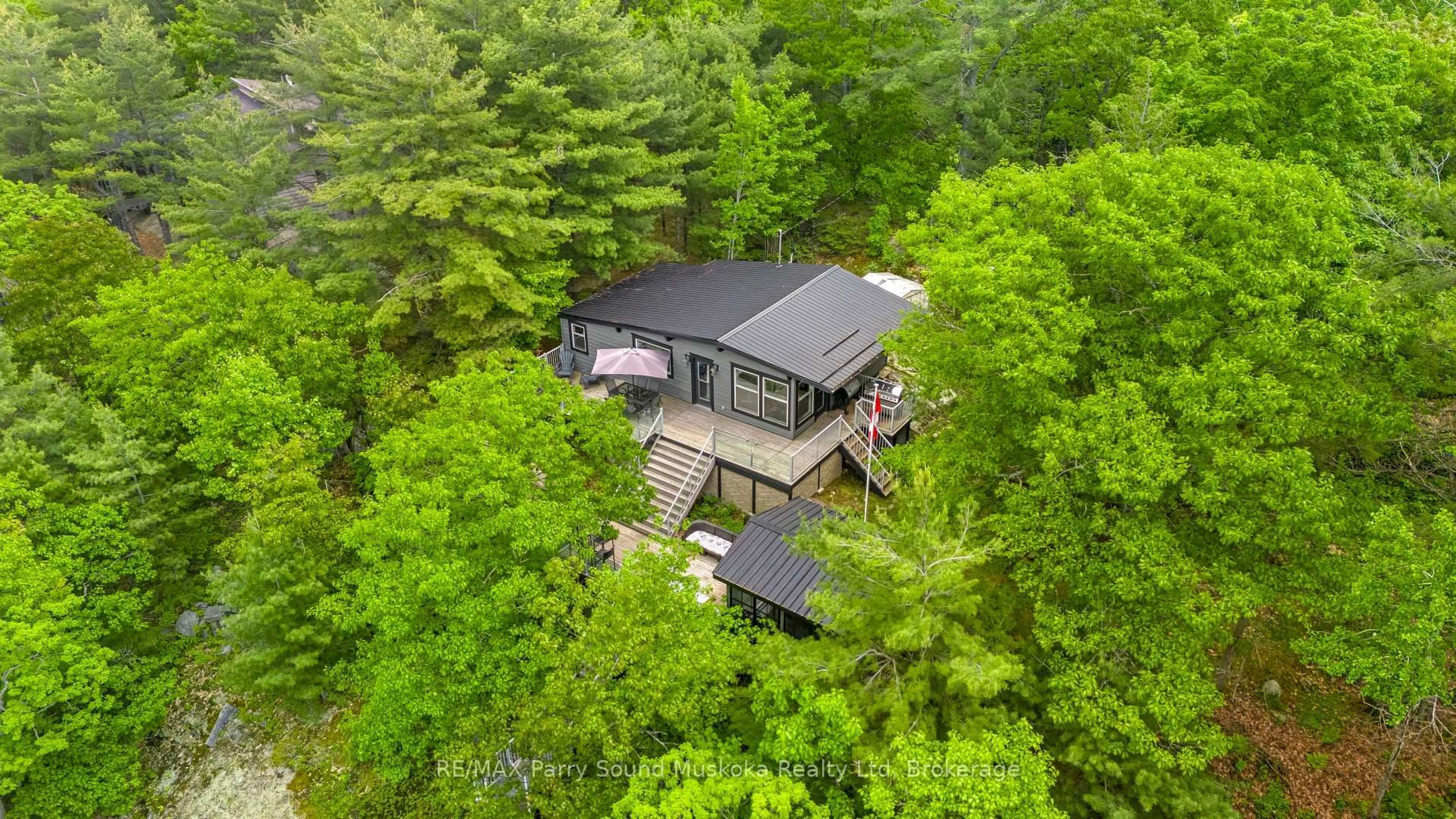 A pic from outside/outdoor area/front of a property/back of a property/a pic from drone, forest/trees view for 109 Healey Lake, The Archipelago Ontario P0G 1G0