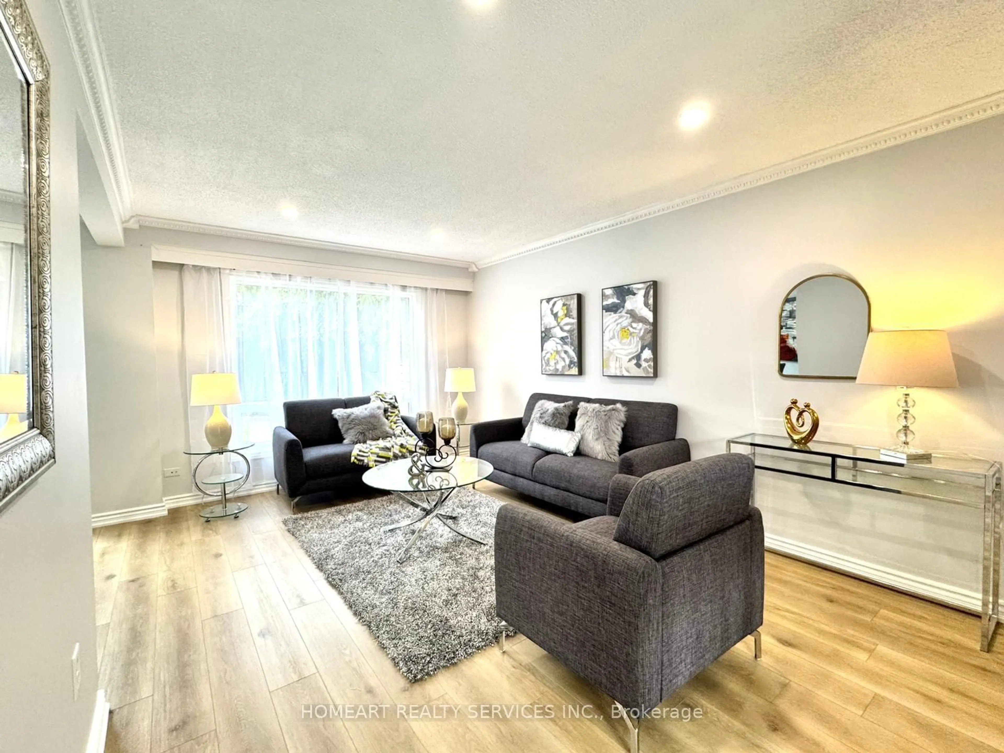 Living room with furniture, wood/laminate floor for 77 Bixby Cres, Hamilton Ontario L8T 4X2