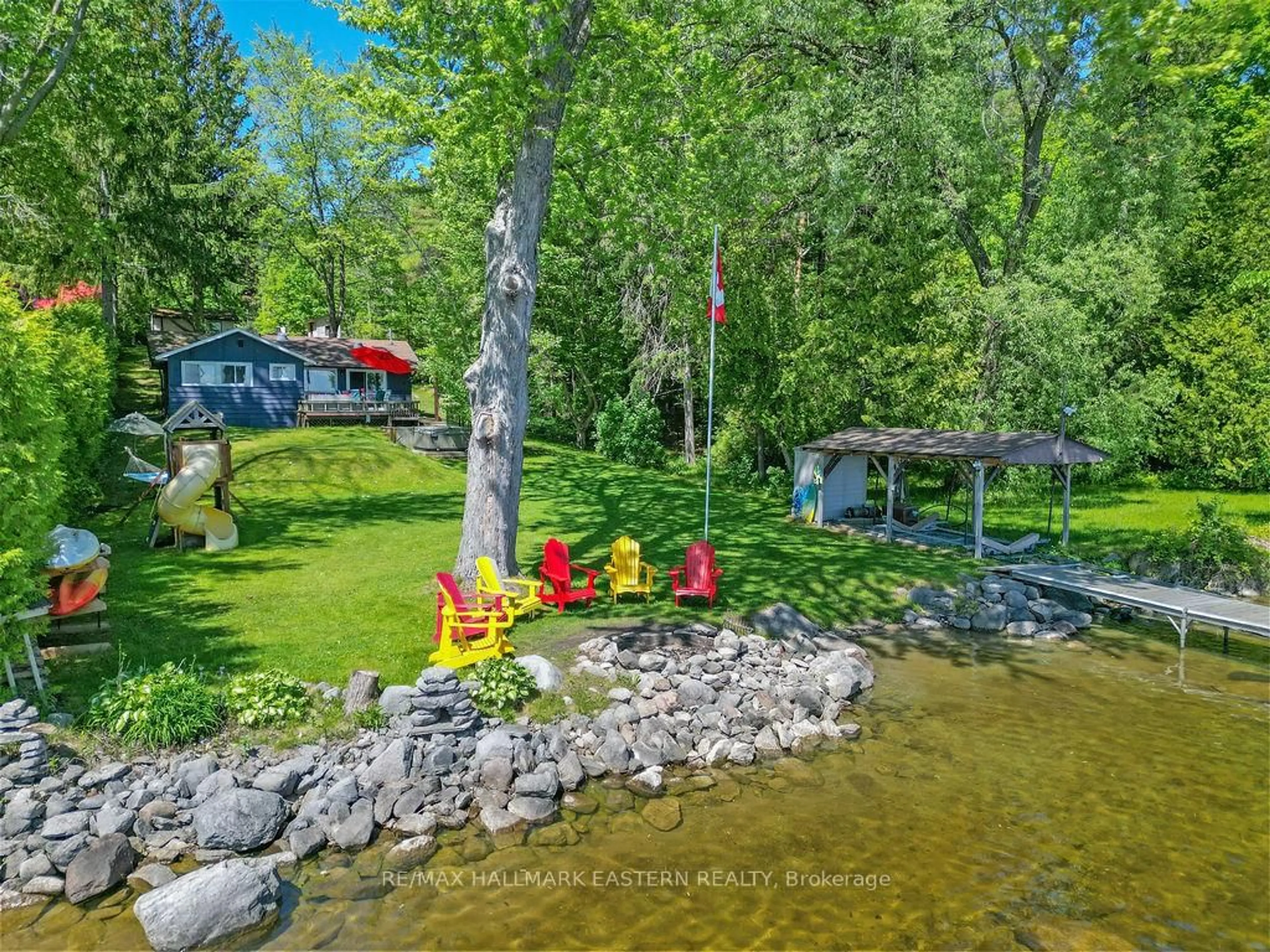 A pic from outside/outdoor area/front of a property/back of a property/a pic from drone, water/lake/river/ocean view for 26 Manitou Lane, Trent Lakes Ontario K0M 1A0