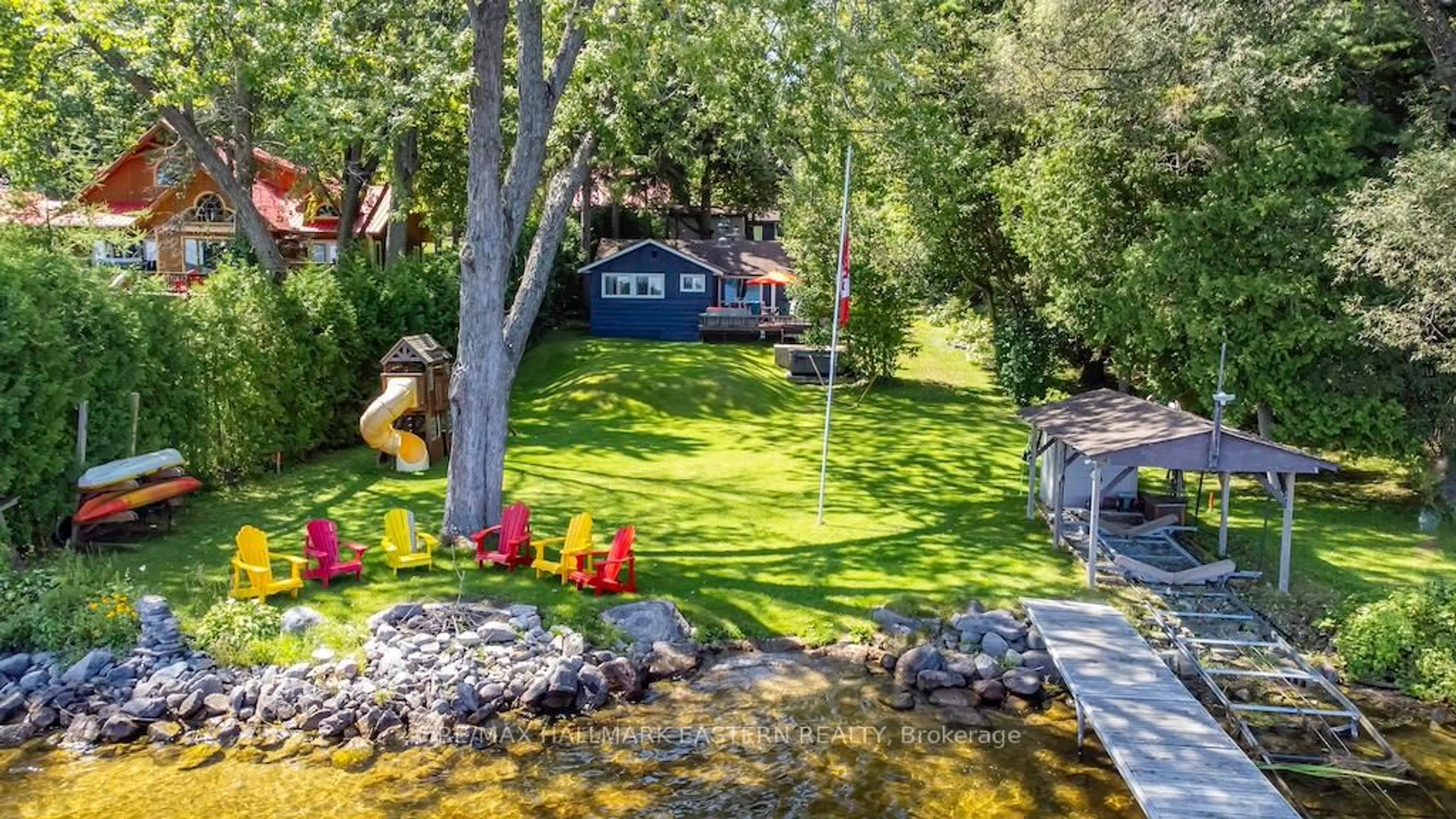 A pic from outside/outdoor area/front of a property/back of a property/a pic from drone, water/lake/river/ocean view for 26 Manitou Lane, Trent Lakes Ontario K0M 1A0