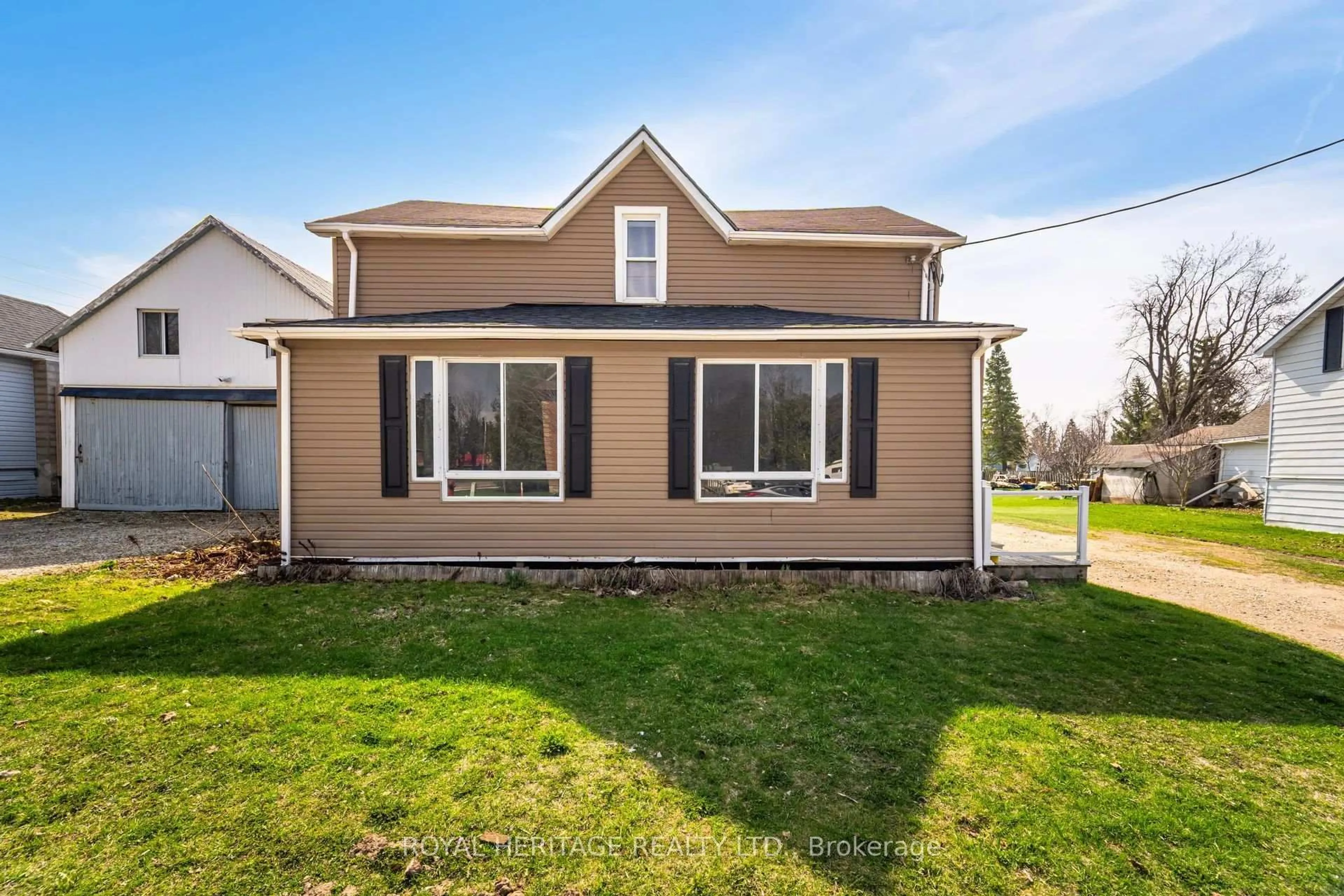 Home with vinyl exterior material, street for 381 Main St, Southgate Ontario N0C 1B0