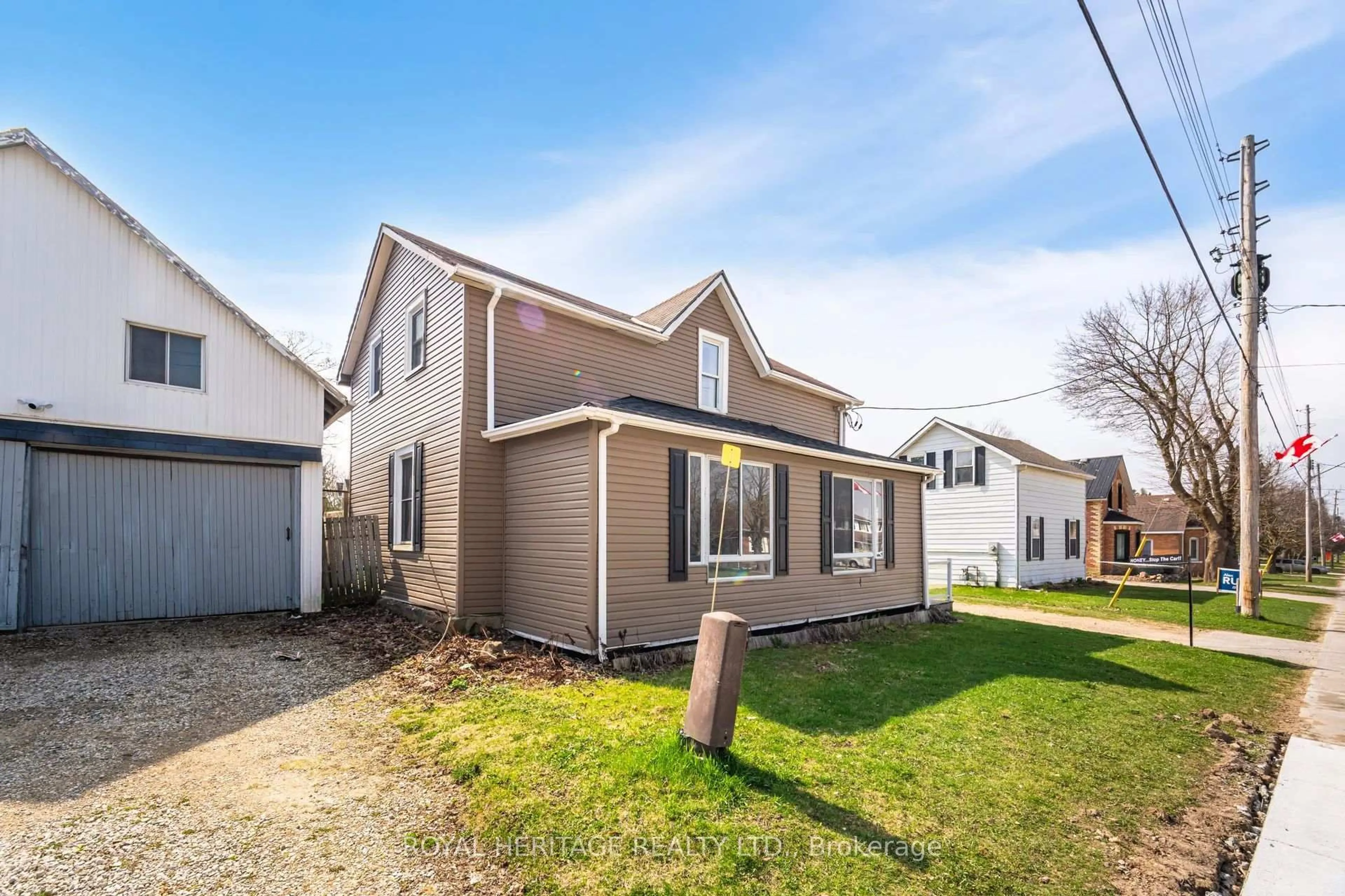 Home with vinyl exterior material, street for 381 Main St, Southgate Ontario N0C 1B0