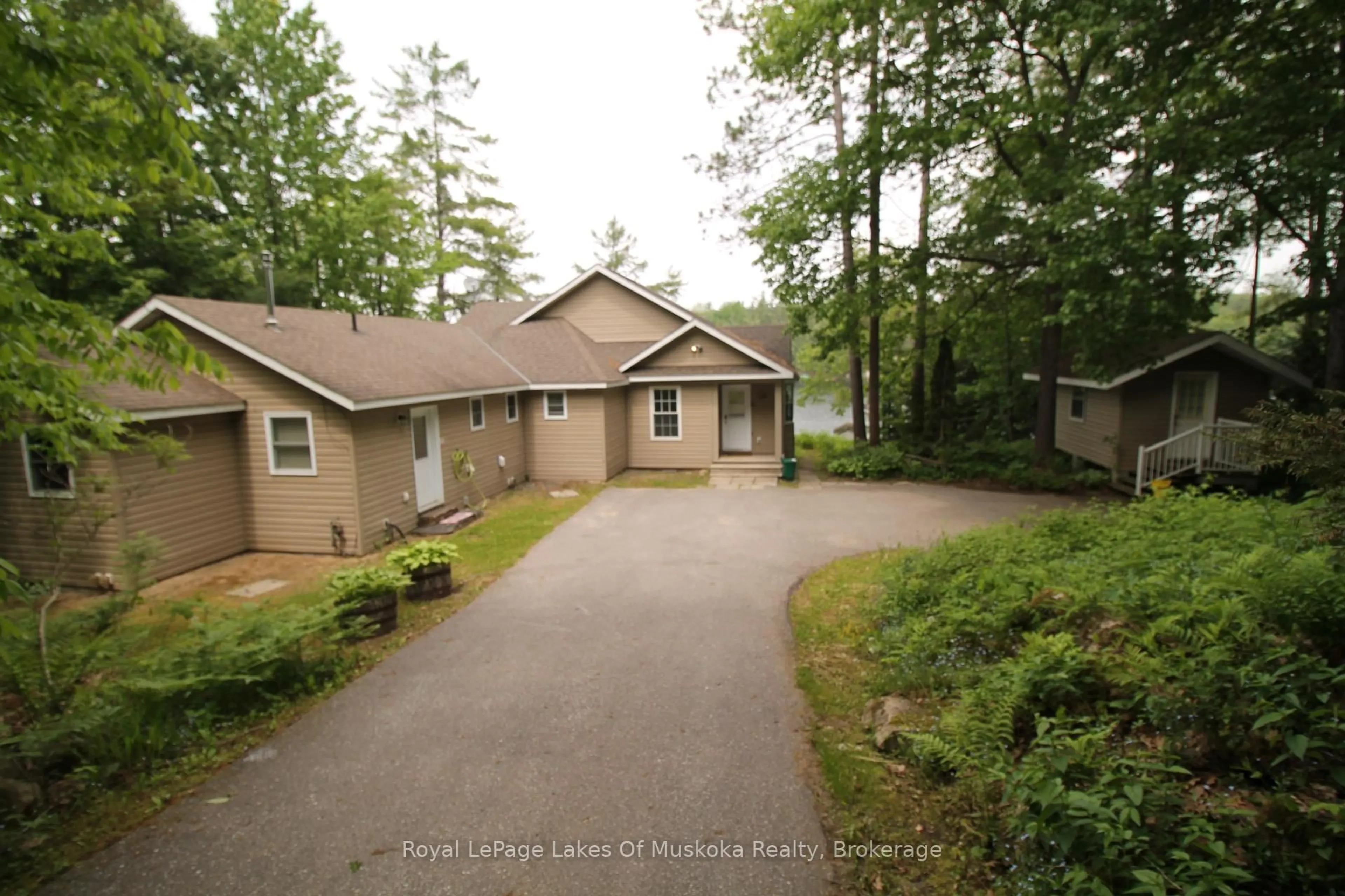 A pic from outside/outdoor area/front of a property/back of a property/a pic from drone, water/lake/river/ocean view for 49 Pinetree Rd, Gravenhurst Ontario P1P 1R2