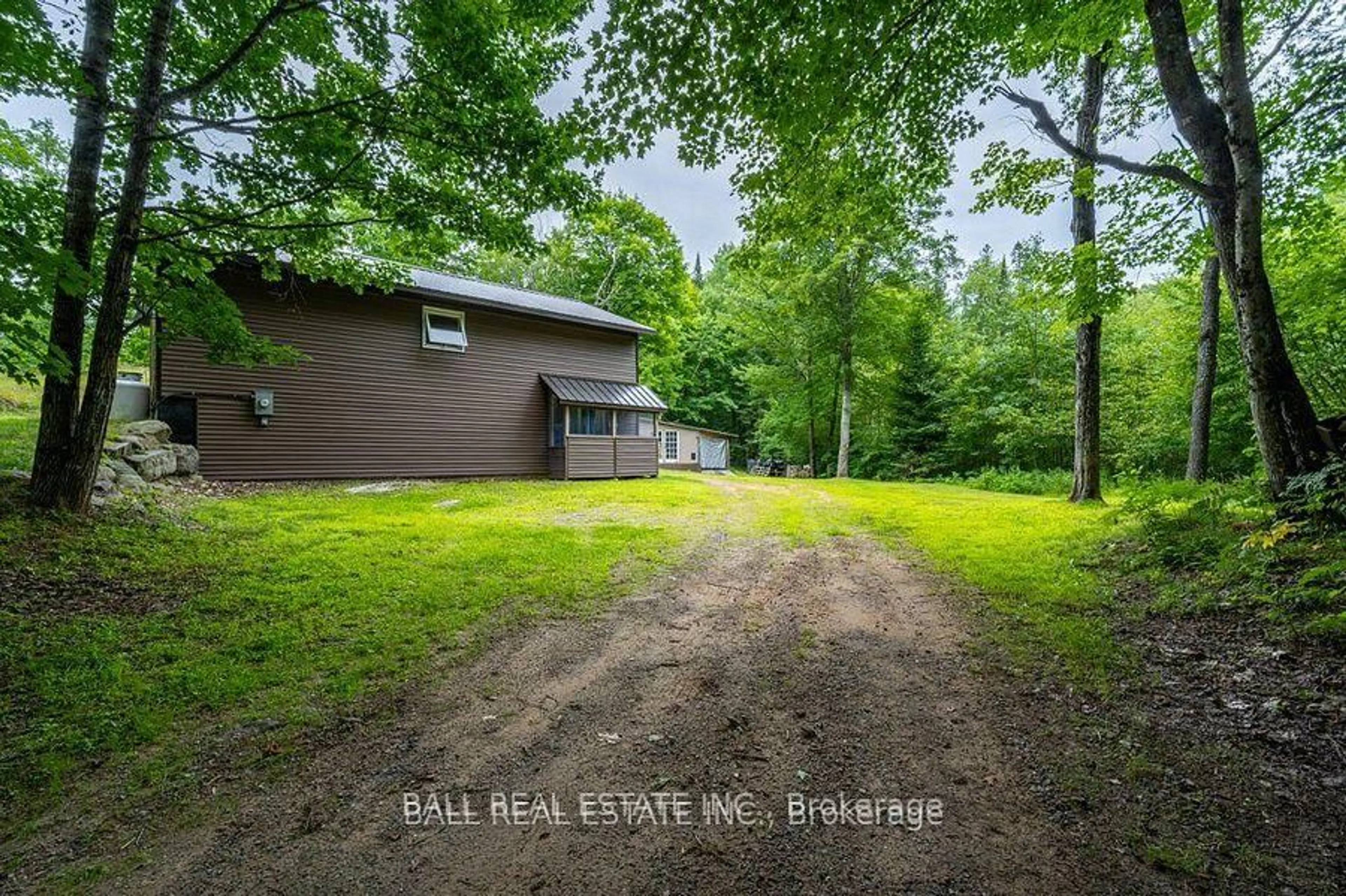 A pic from outside/outdoor area/front of a property/back of a property/a pic from drone, forest/trees view for 1794 Hadlington Rd, Highlands East Ontario K0L 2Y0