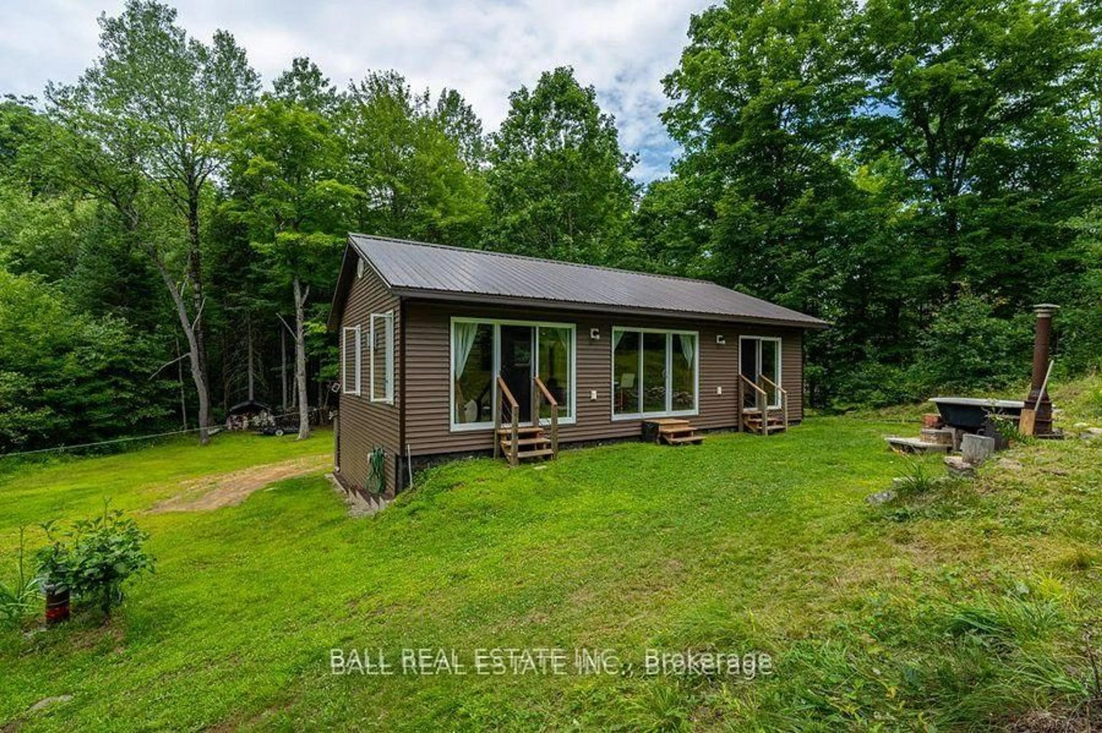 A pic from outside/outdoor area/front of a property/back of a property/a pic from drone, water/lake/river/ocean view for 1794 Hadlington Rd, Highlands East Ontario K0L 2Y0