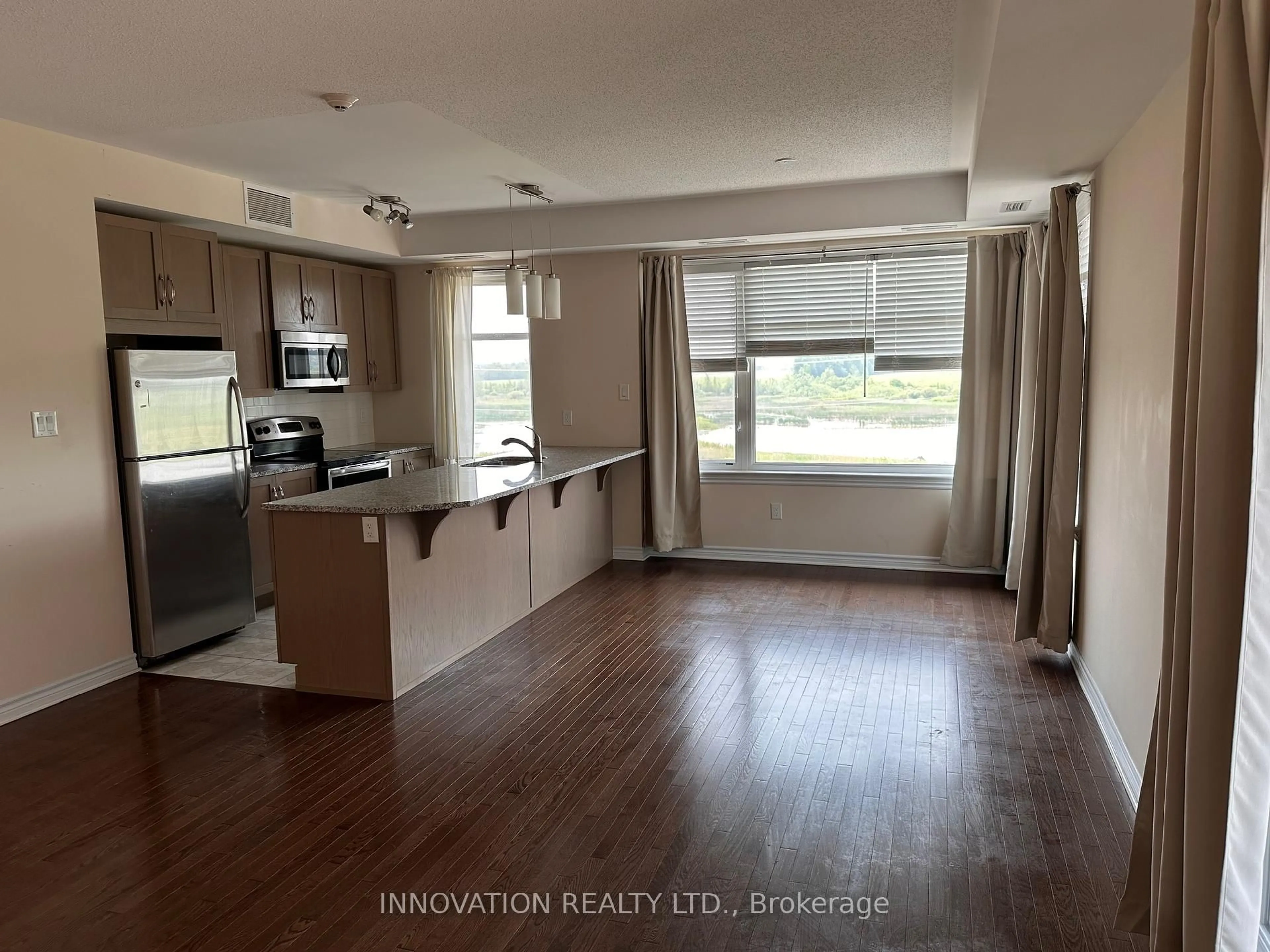 Open concept kitchen, wood/laminate floor for 180 guelph Private, Kanata Ontario K2T 0J6
