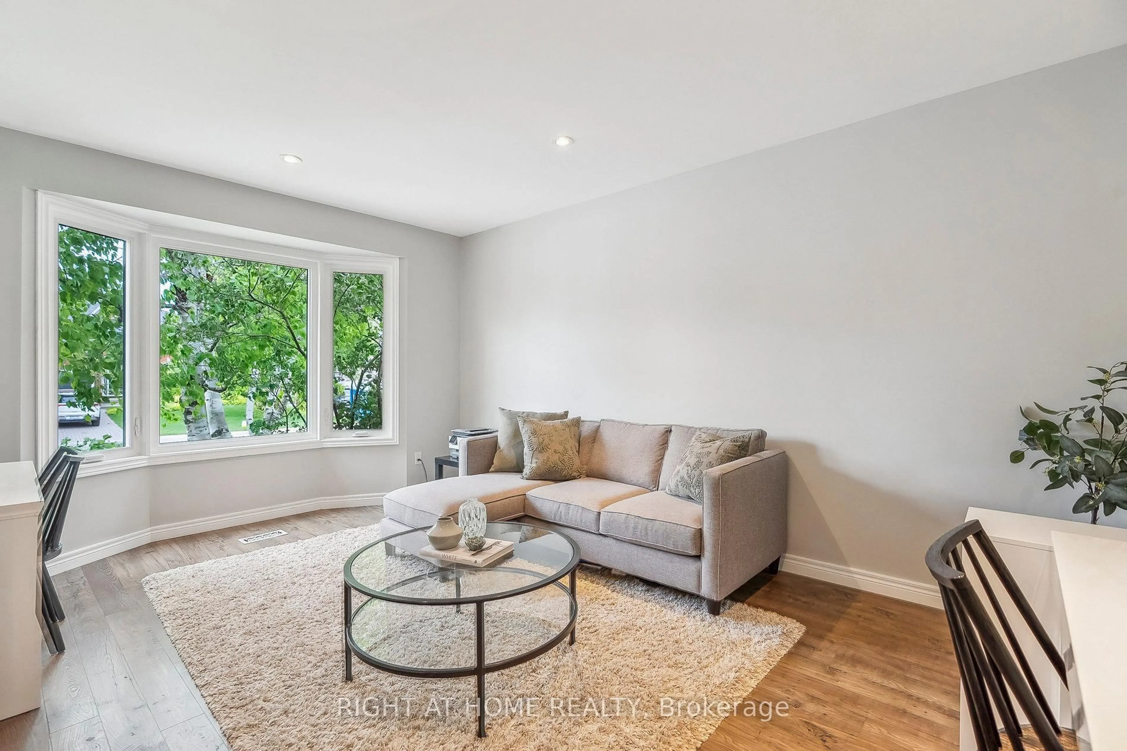 Living room with furniture, wood/laminate floor for 44 Citation Cres, Hamilton Ontario L9K 1H8