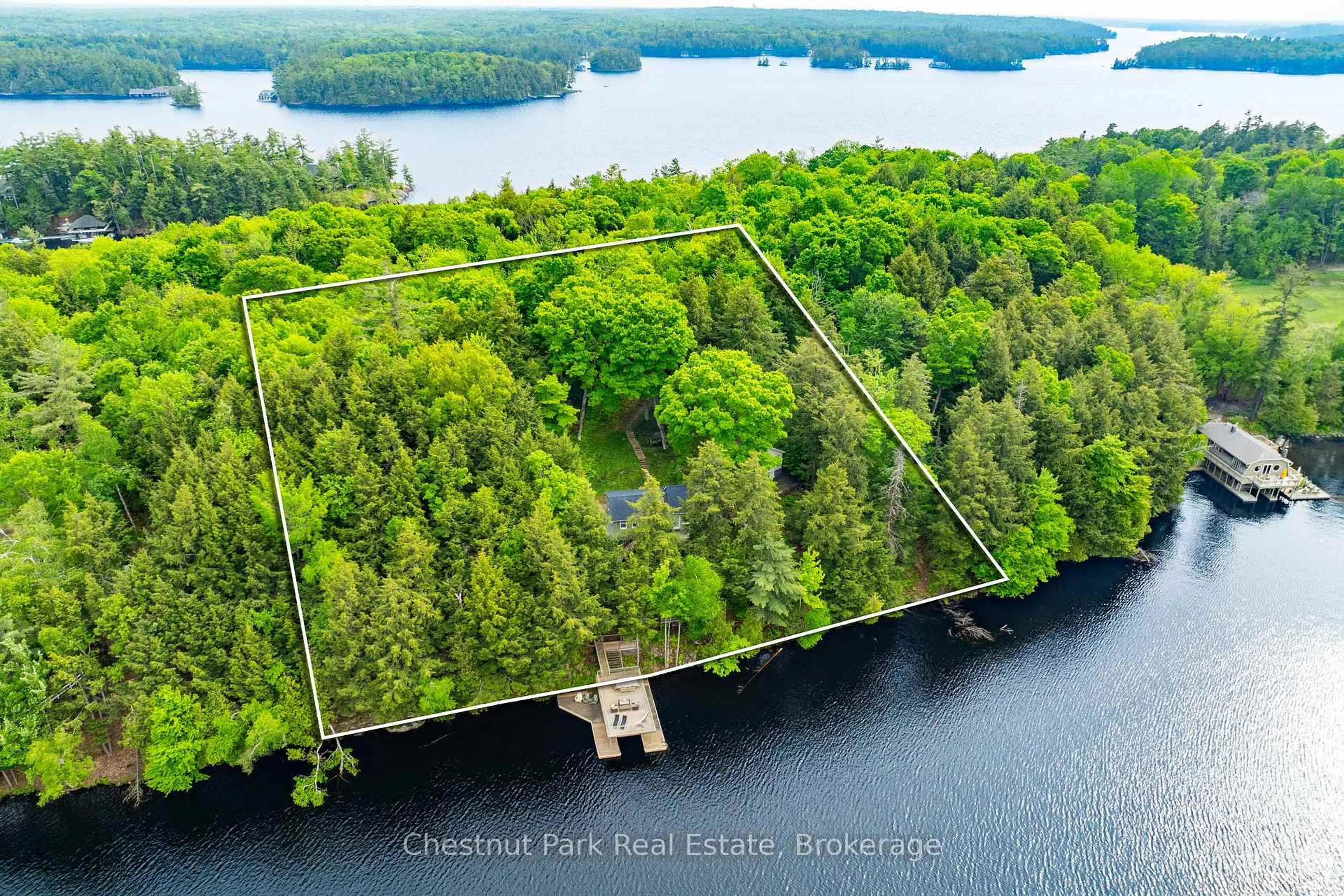 A pic from outside/outdoor area/front of a property/back of a property/a pic from drone, water/lake/river/ocean view for 1111 Tondern Island Rd, Muskoka Lakes Ontario P0B 1E0