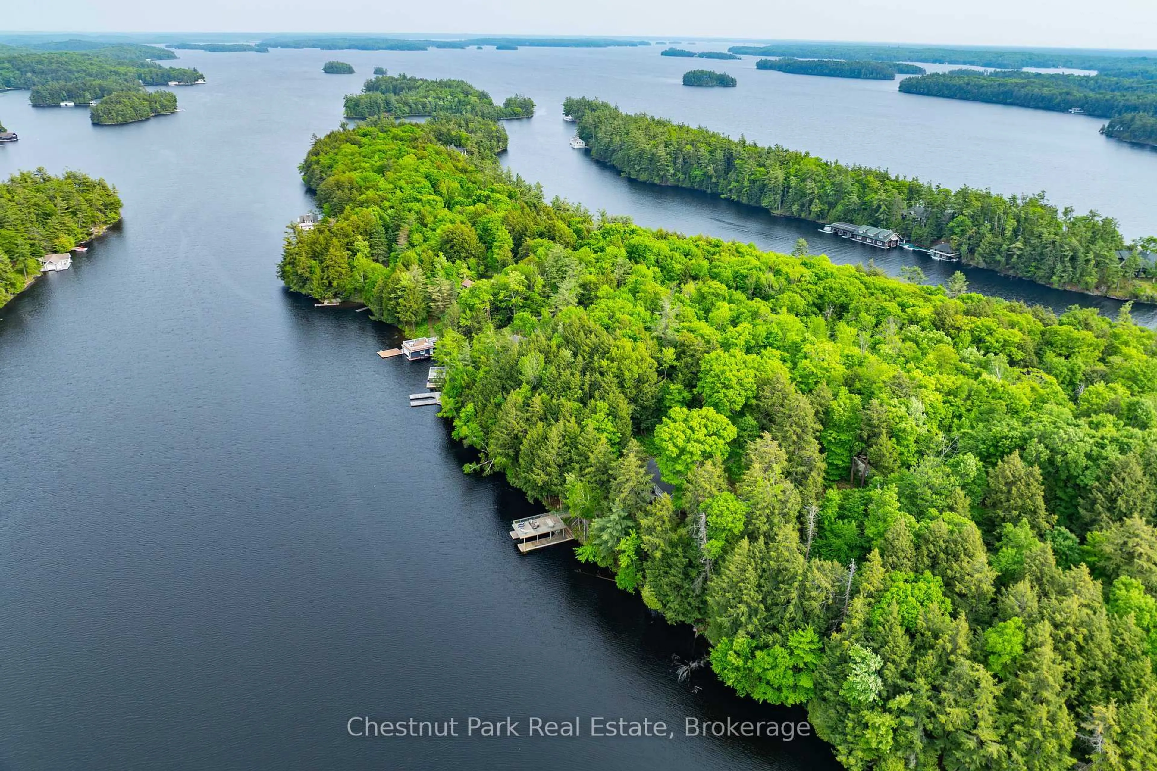 A pic from outside/outdoor area/front of a property/back of a property/a pic from drone, water/lake/river/ocean view for 1111 Tondern Island Rd, Muskoka Lakes Ontario P0B 1E0