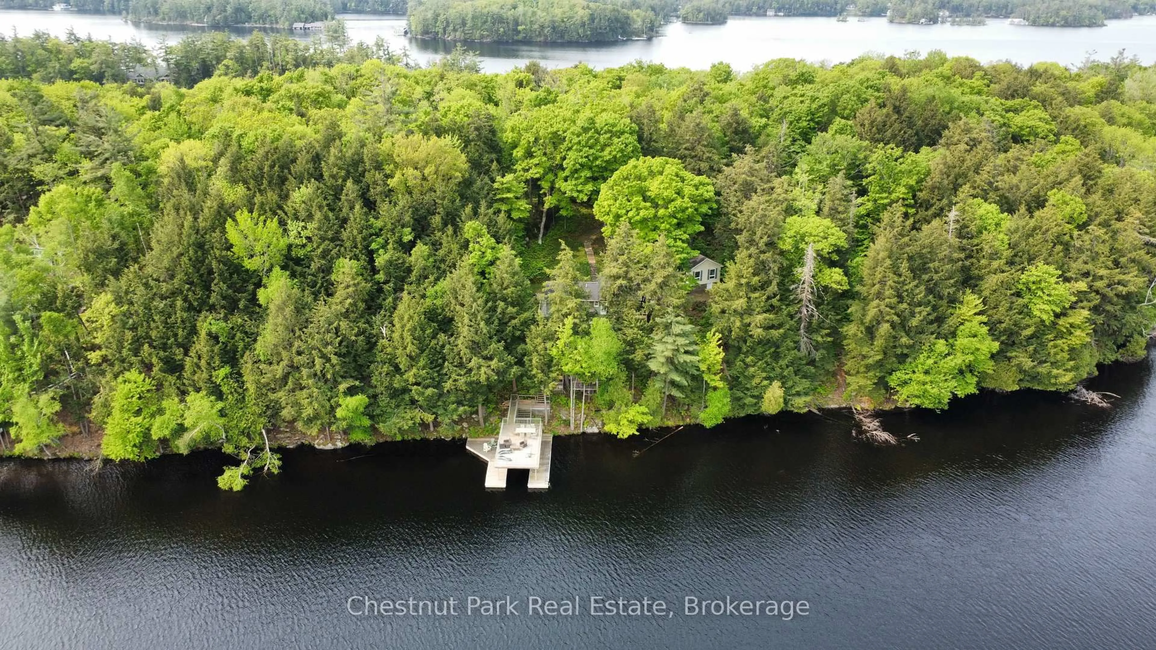 A pic from outside/outdoor area/front of a property/back of a property/a pic from drone, water/lake/river/ocean view for 1111 Tondern Island Rd, Muskoka Lakes Ontario P0B 1E0