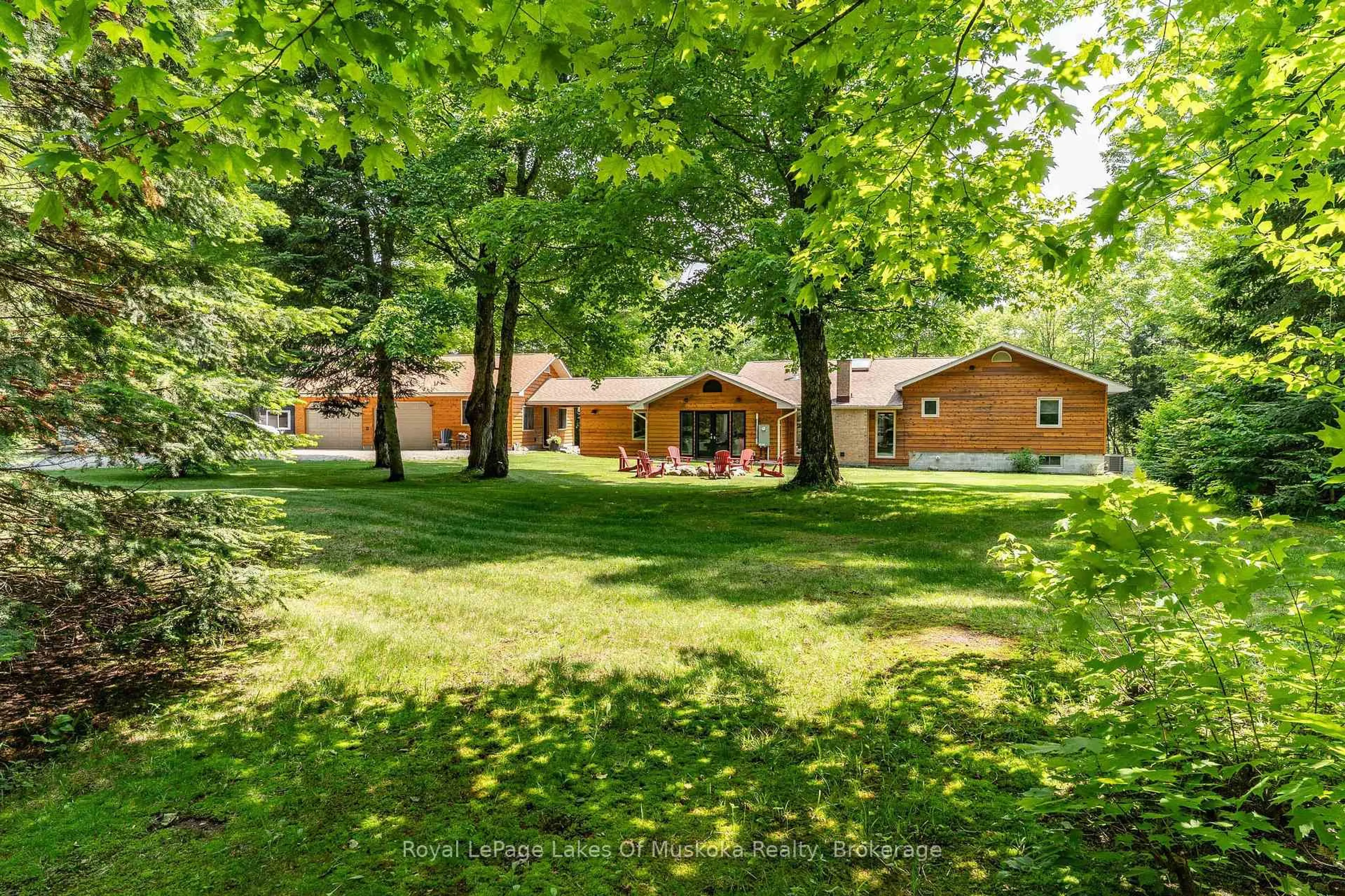 A pic from outside/outdoor area/front of a property/back of a property/a pic from drone, forest/trees view for 1319 Wolf Circ, Algonquin Highlands Ontario P0A 1E0