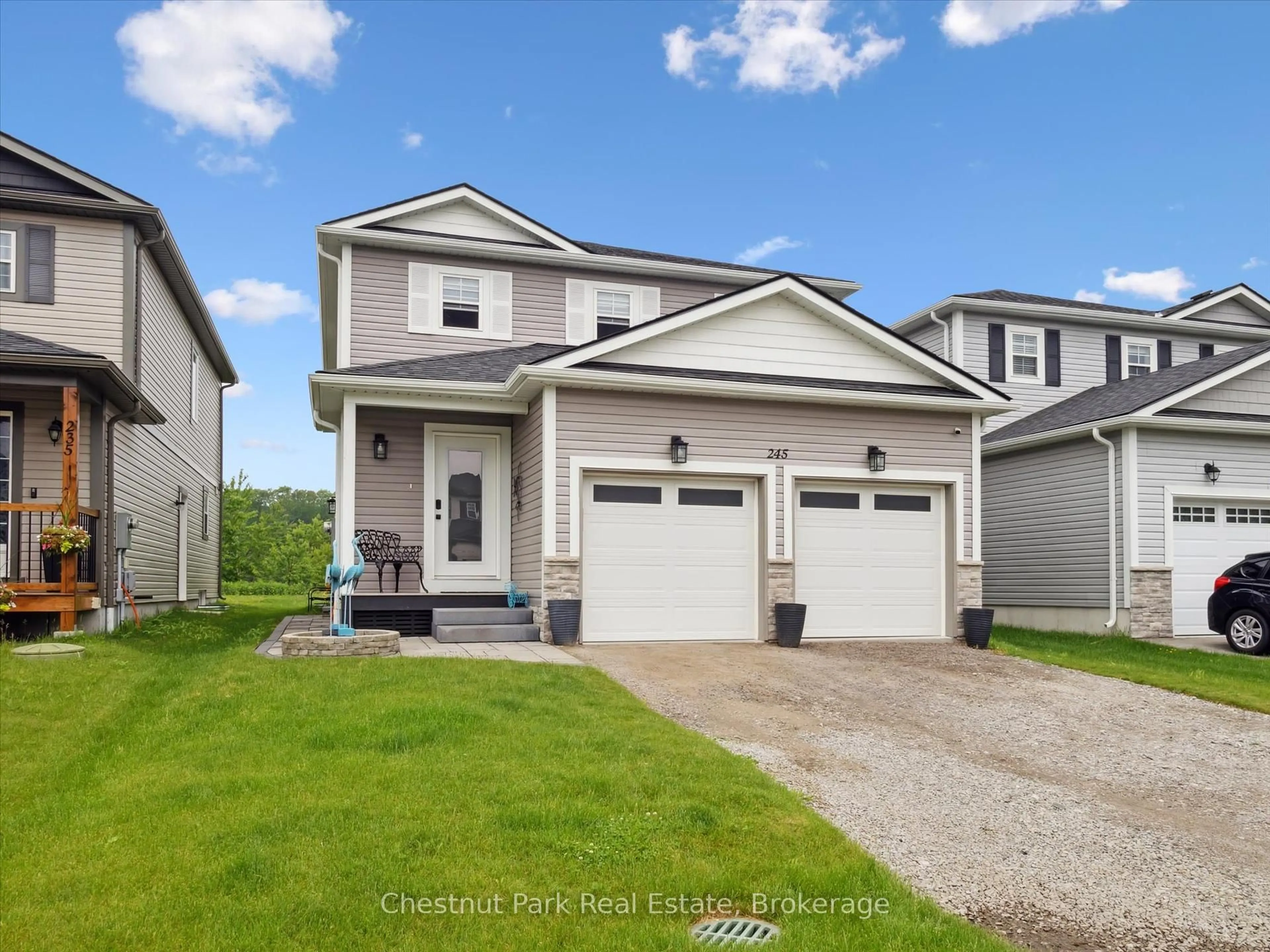 Home with vinyl exterior material, street for 245 Wild Rose Dr, Gravenhurst Ontario P1P 0B4