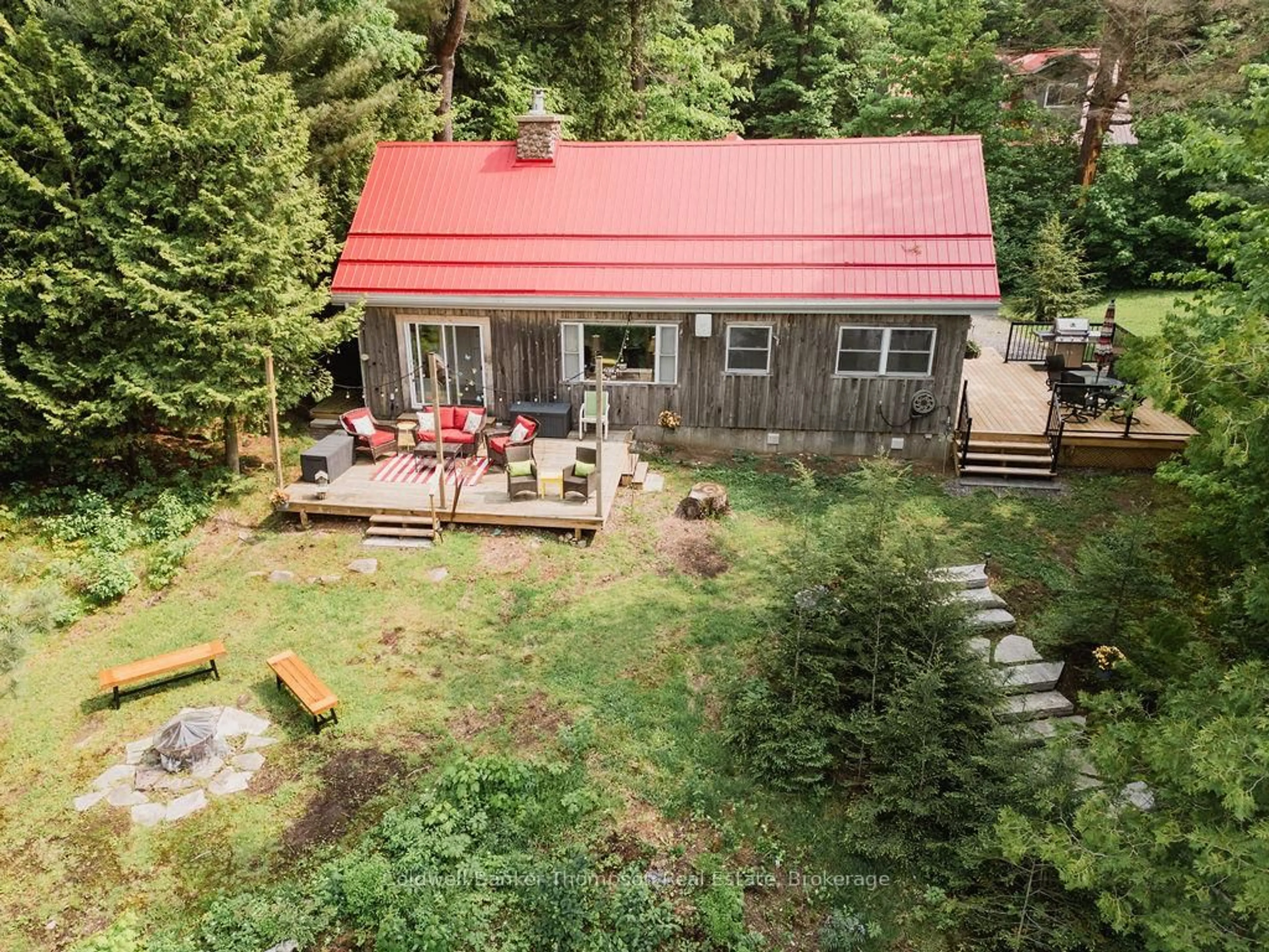 A pic from outside/outdoor area/front of a property/back of a property/a pic from drone, forest/trees view for 219 Hawthorne Dr, Machar Ontario P0A 1X0