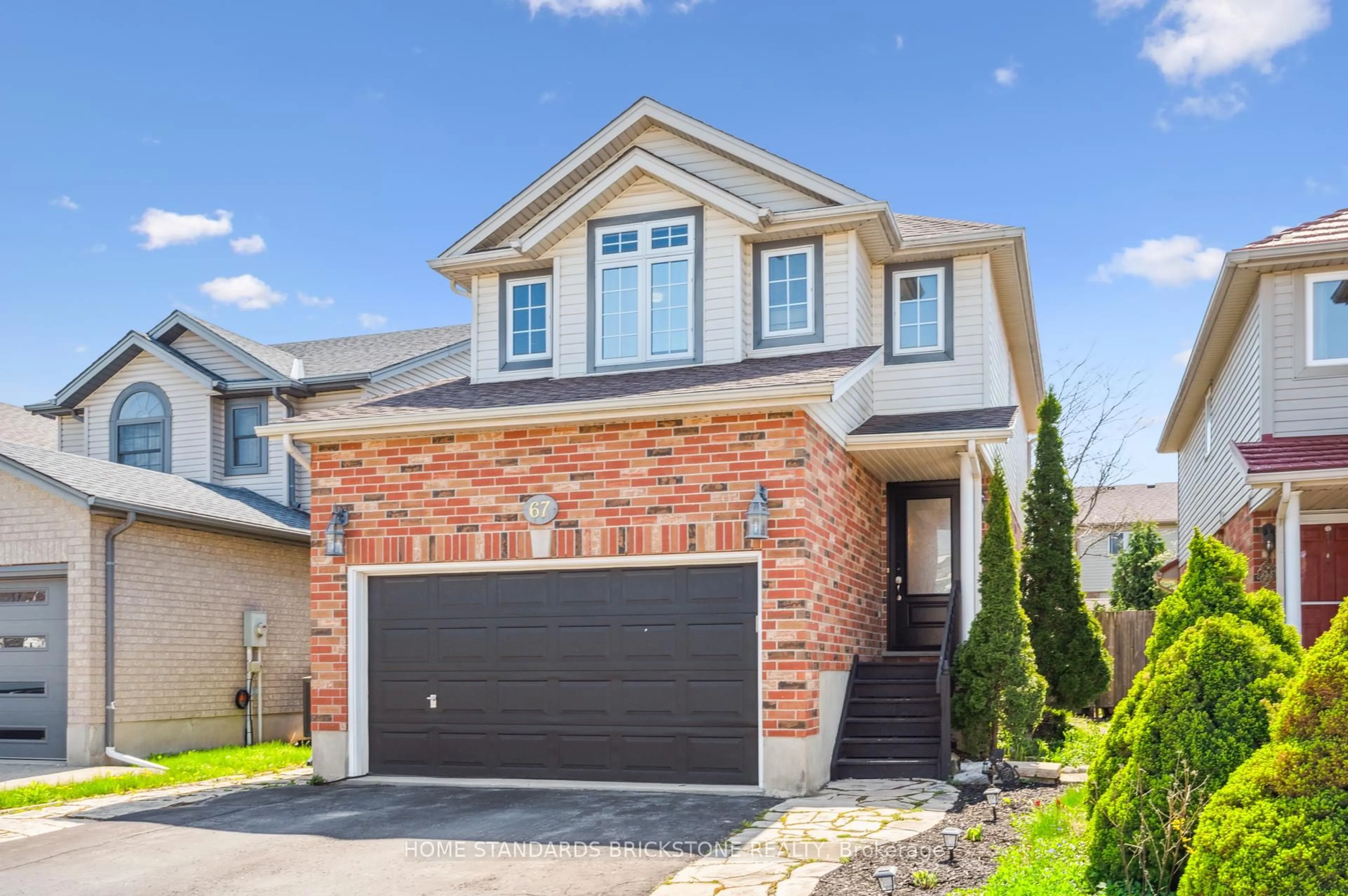 Home with brick exterior material, street for 67 Cotton Grass St, Kitchener Ontario N2E 3T7