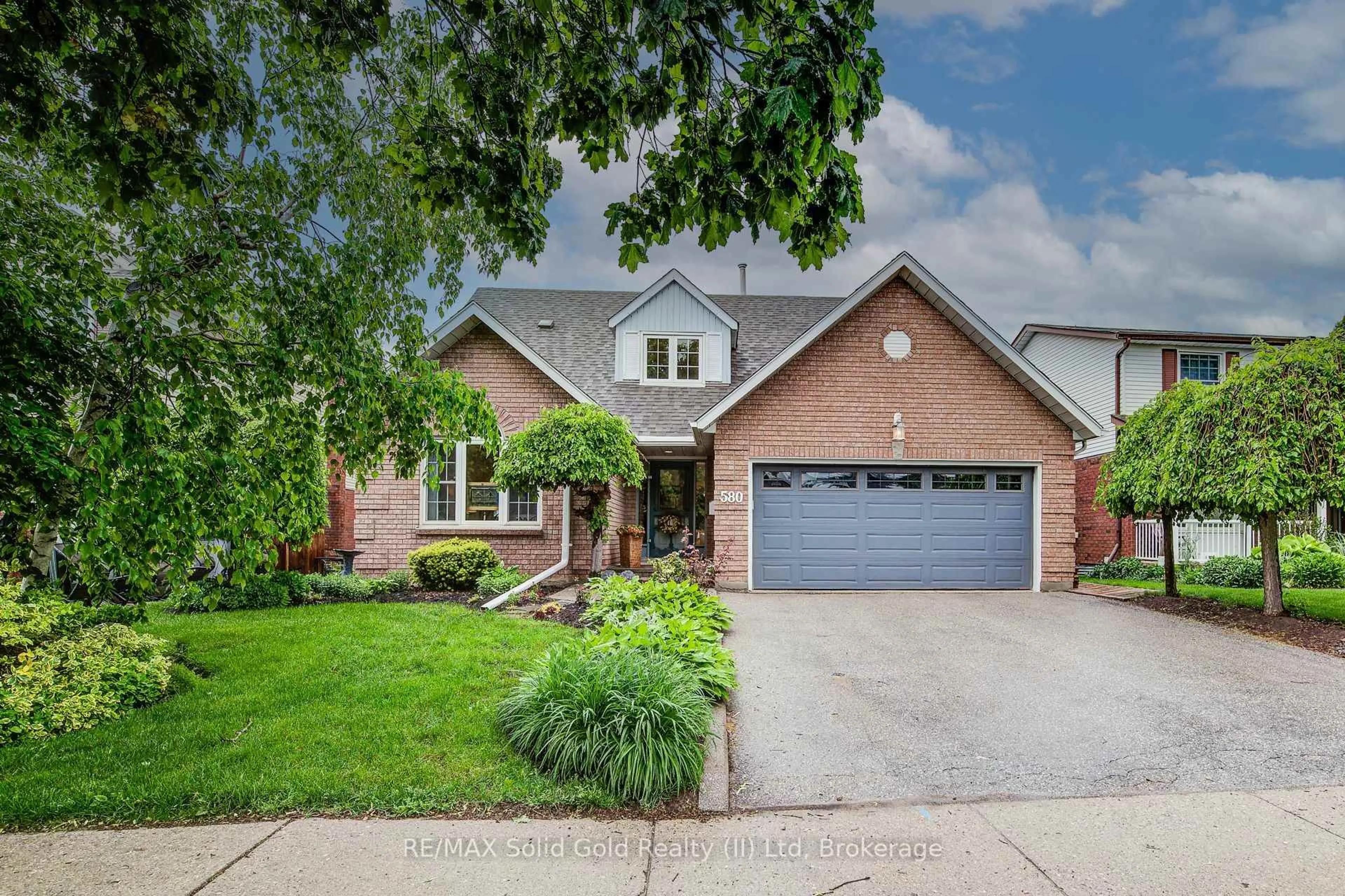 Home with brick exterior material, street for 580 Hallmark Dr, Waterloo Ontario N2K 3P2