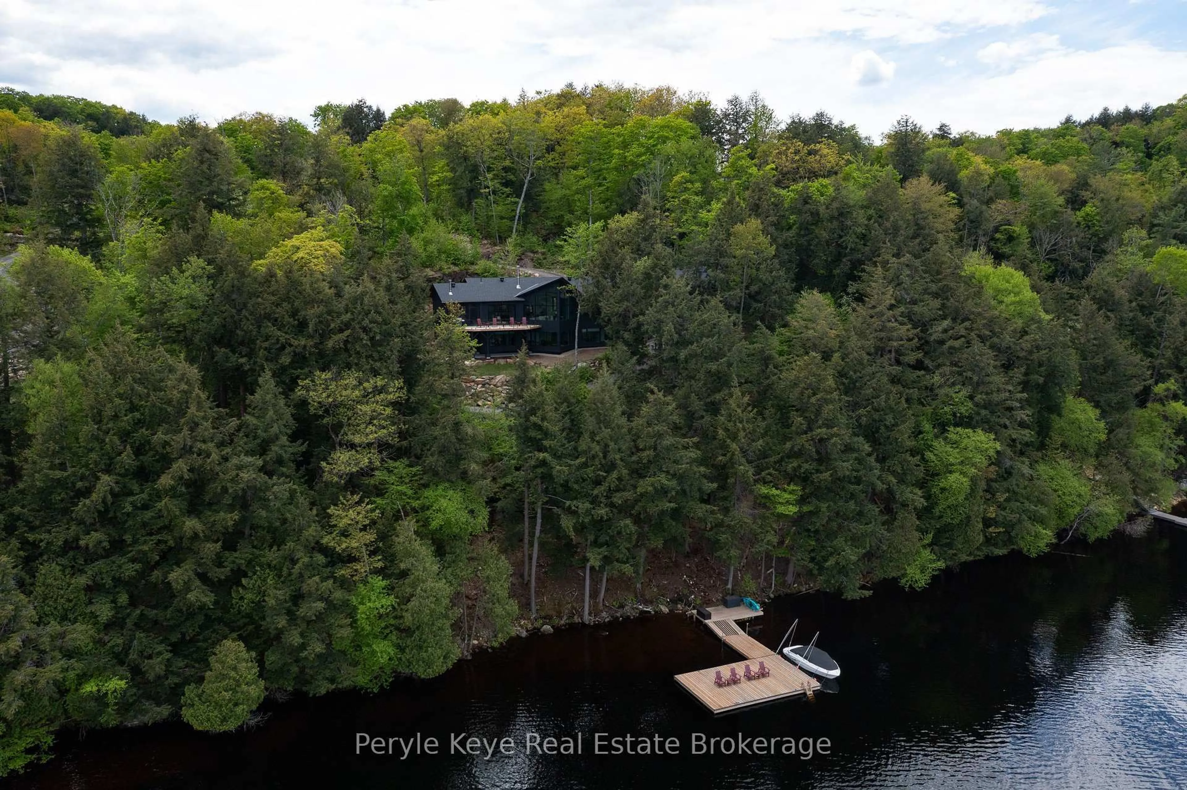 A pic from outside/outdoor area/front of a property/back of a property/a pic from drone, water/lake/river/ocean view for 86 Claren Cres, Huntsville Ontario P1H 0C3