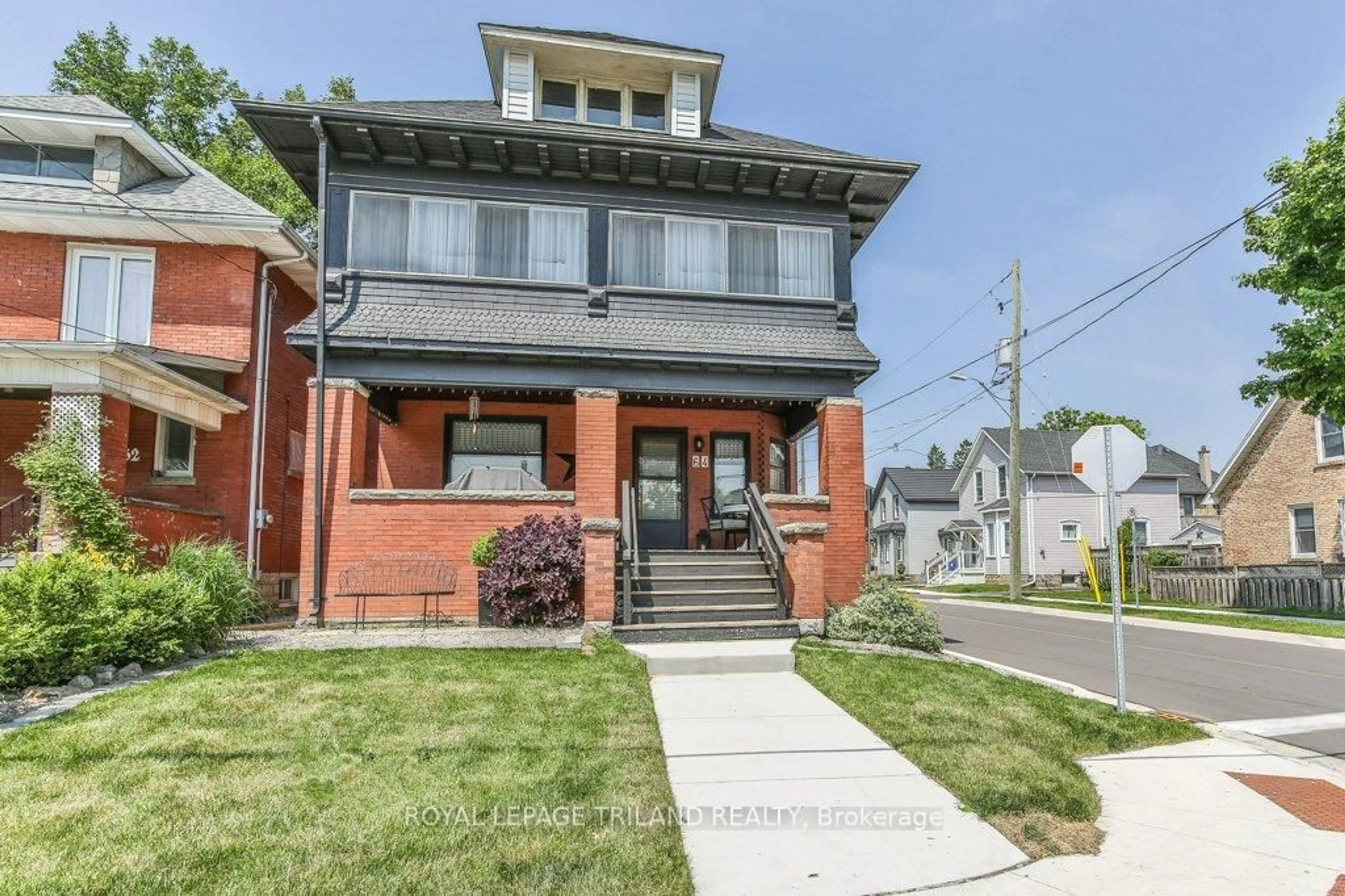Home with brick exterior material, street for 64 EAST St, St. Thomas Ontario N5P 1R9