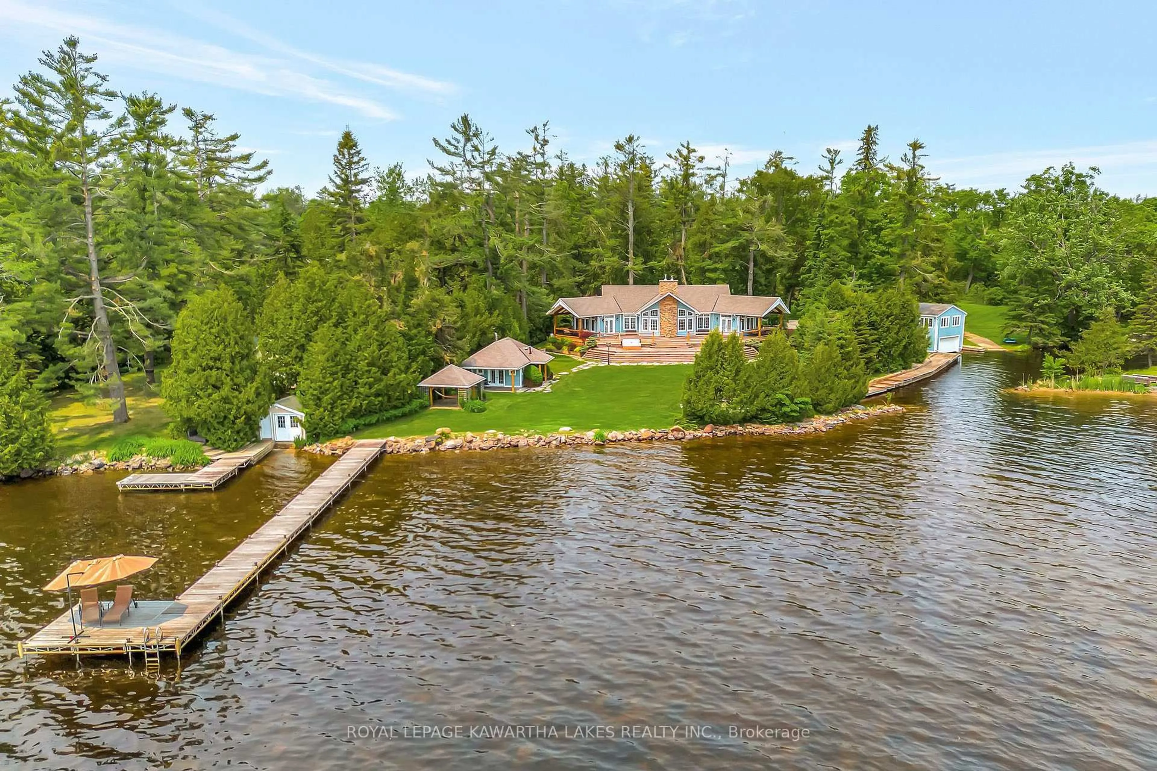 A pic from outside/outdoor area/front of a property/back of a property/a pic from drone, water/lake/river/ocean view for 1484 County Road 8, Kawartha Lakes Ontario K0M 1N0