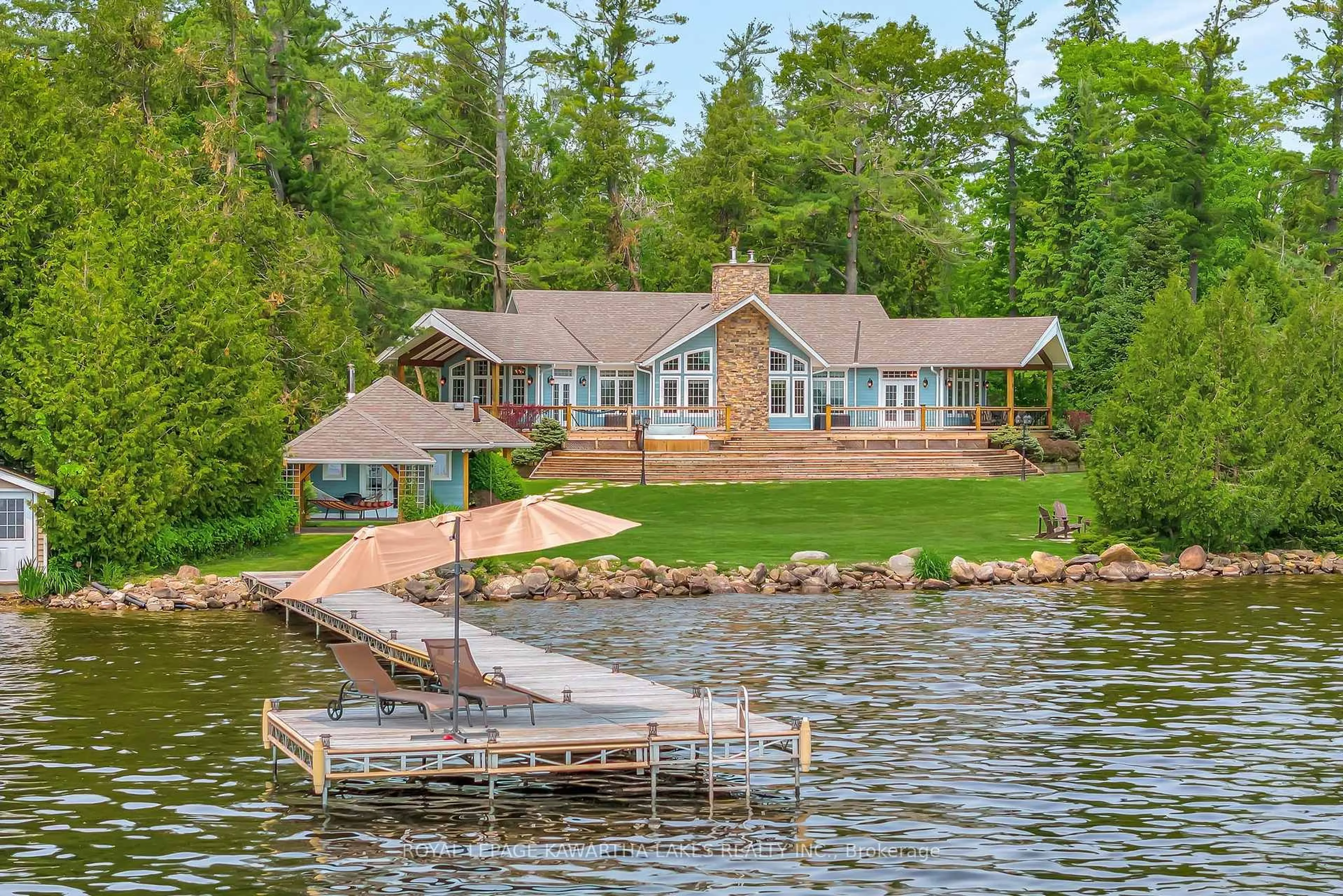 A pic from outside/outdoor area/front of a property/back of a property/a pic from drone, water/lake/river/ocean view for 1484 County Road 8, Kawartha Lakes Ontario K0M 1N0