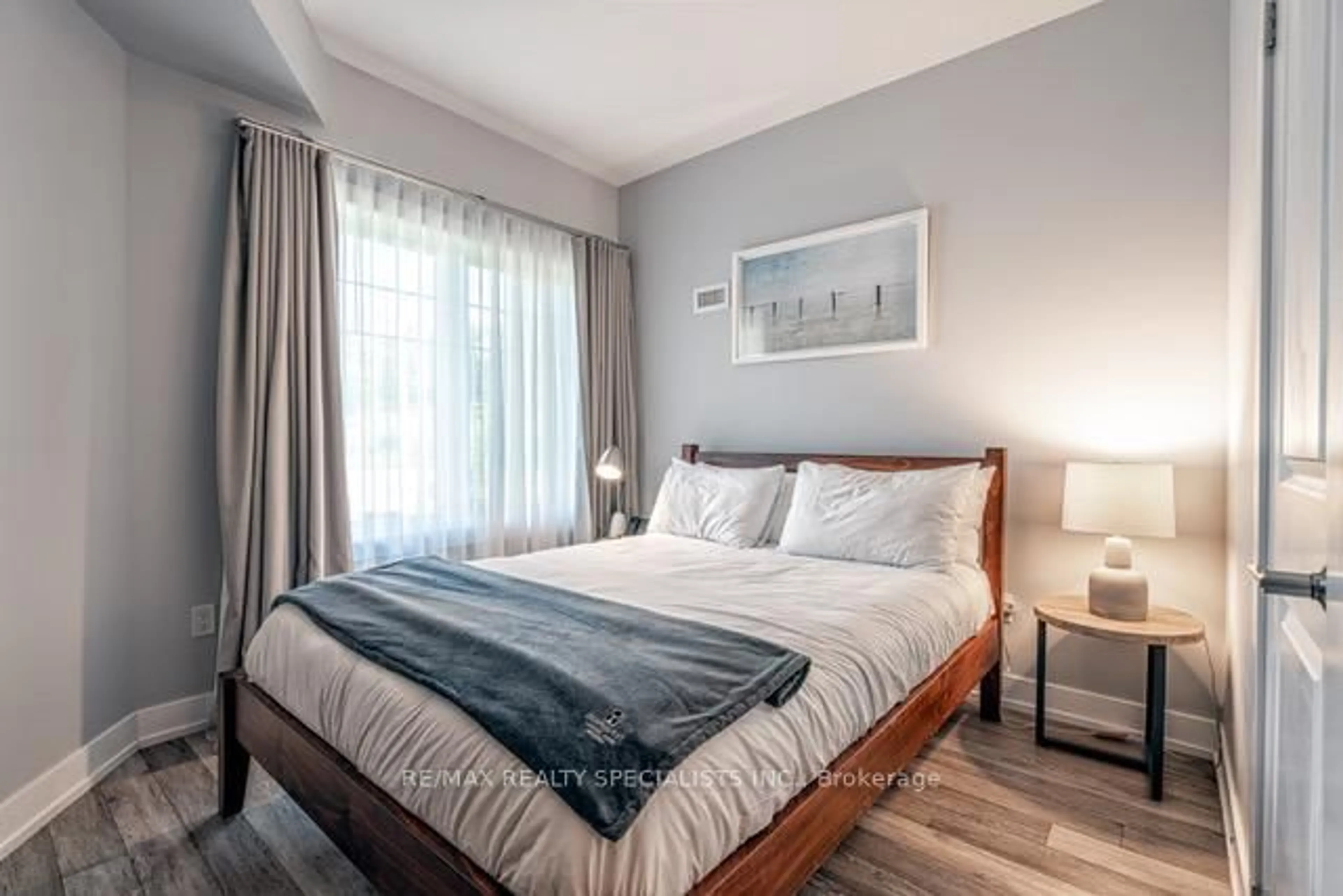 Bedroom with bed, wood/laminate floor for 25 Pen Lake Point Rd #230, Huntsville Ontario P1H 1A9