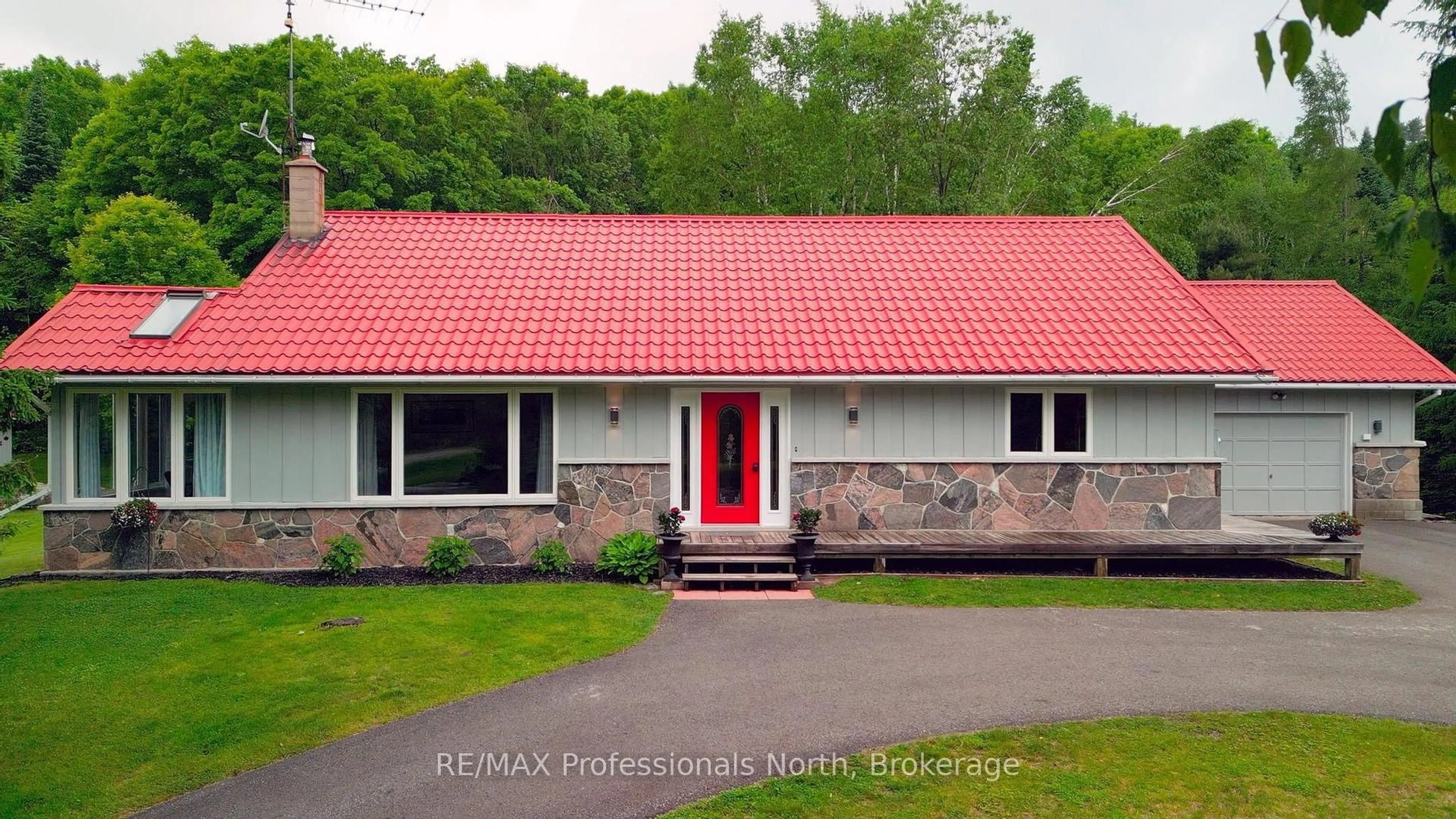 Home with vinyl exterior material, street for 1006 Tennyson Rd, Minden Hills Ontario K0M 2K0