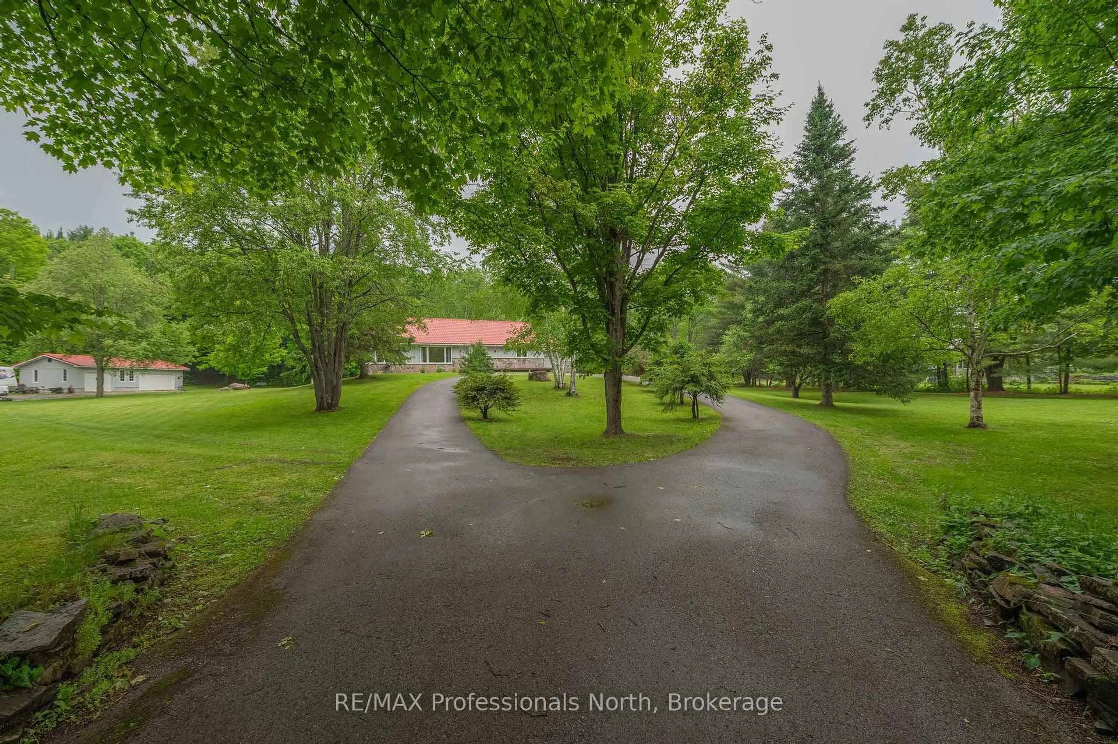 A pic from outside/outdoor area/front of a property/back of a property/a pic from drone, street for 1006 Tennyson Rd, Minden Hills Ontario K0M 2K0