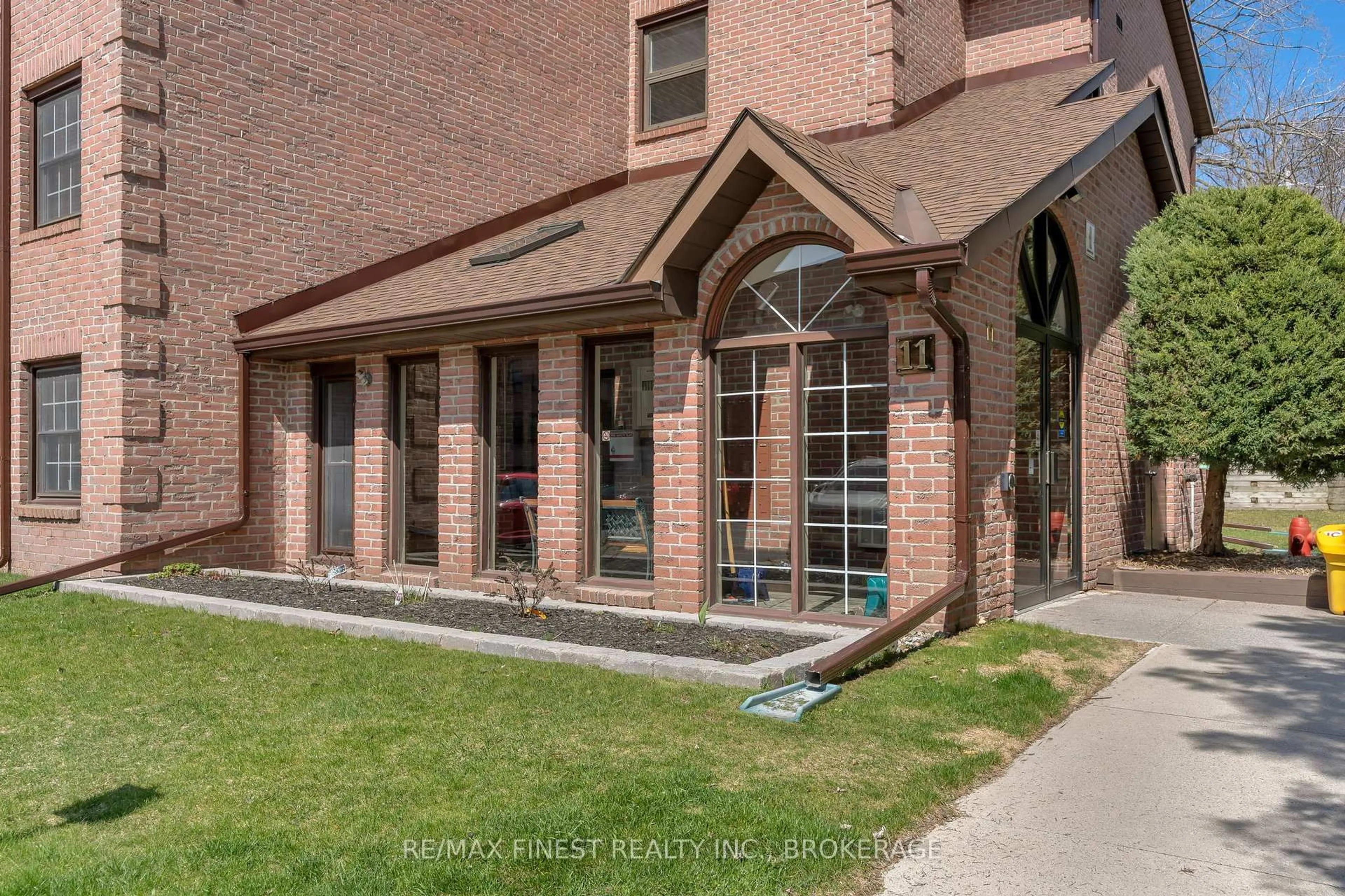 Home with brick exterior material, street for 11 Centre St #205, Greater Napanee Ontario K7R 3X3