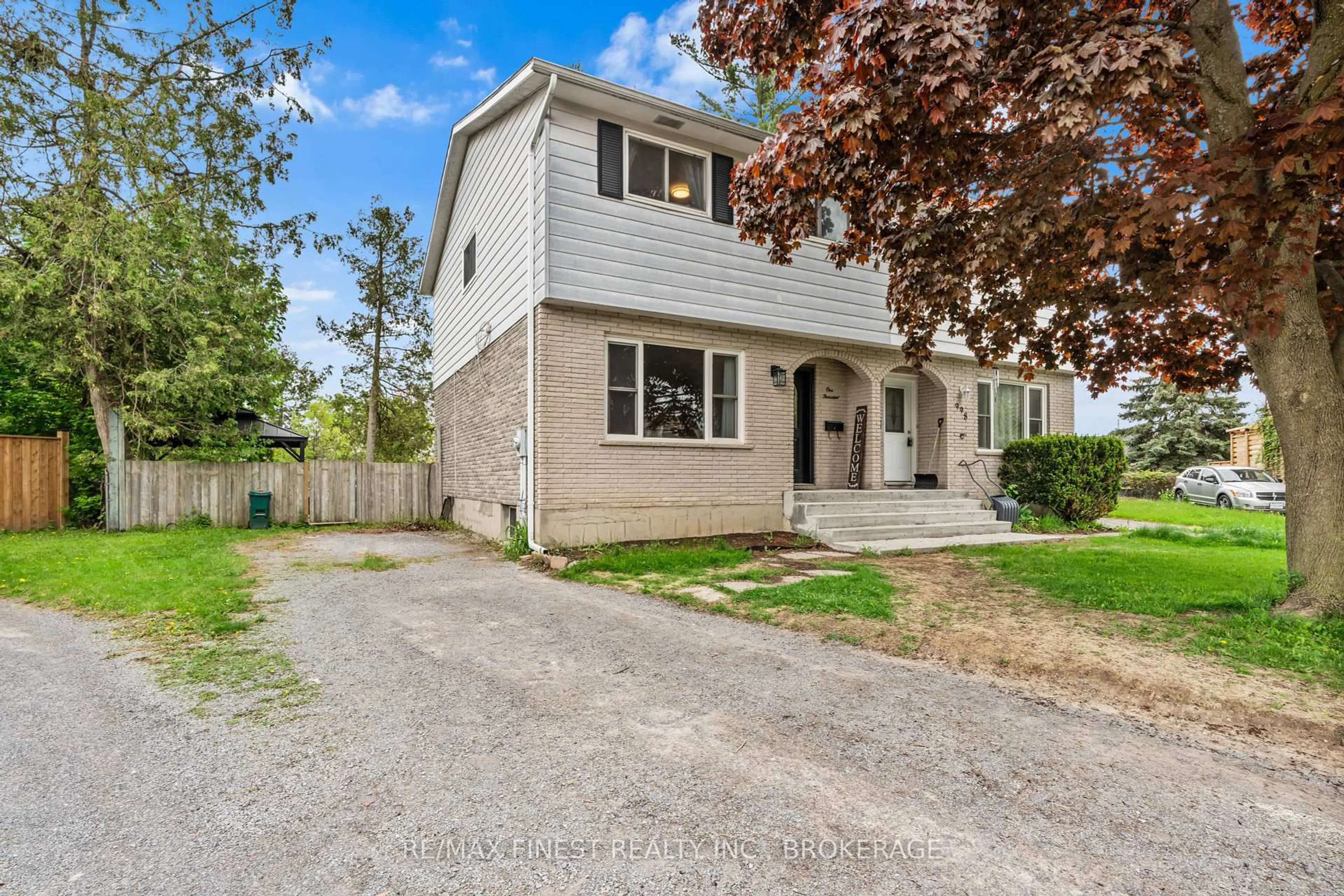 Home with vinyl exterior material, street for 1000 Sprucewood Cres, Kingston Ontario K7P 1N1