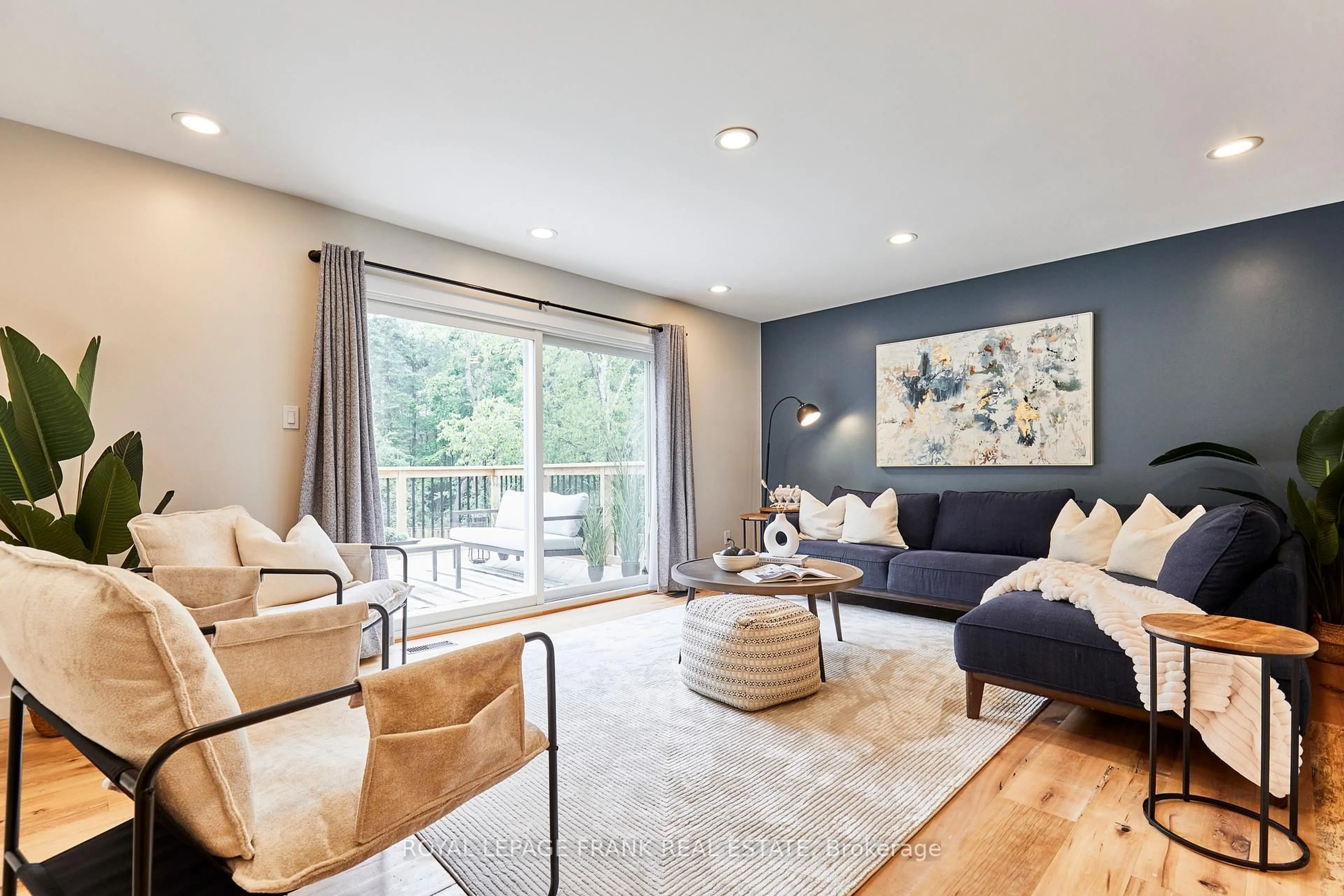 Living room with furniture, wood/laminate floor for 132 Coulter Dr, Kawartha Lakes Ontario L0A 1K0