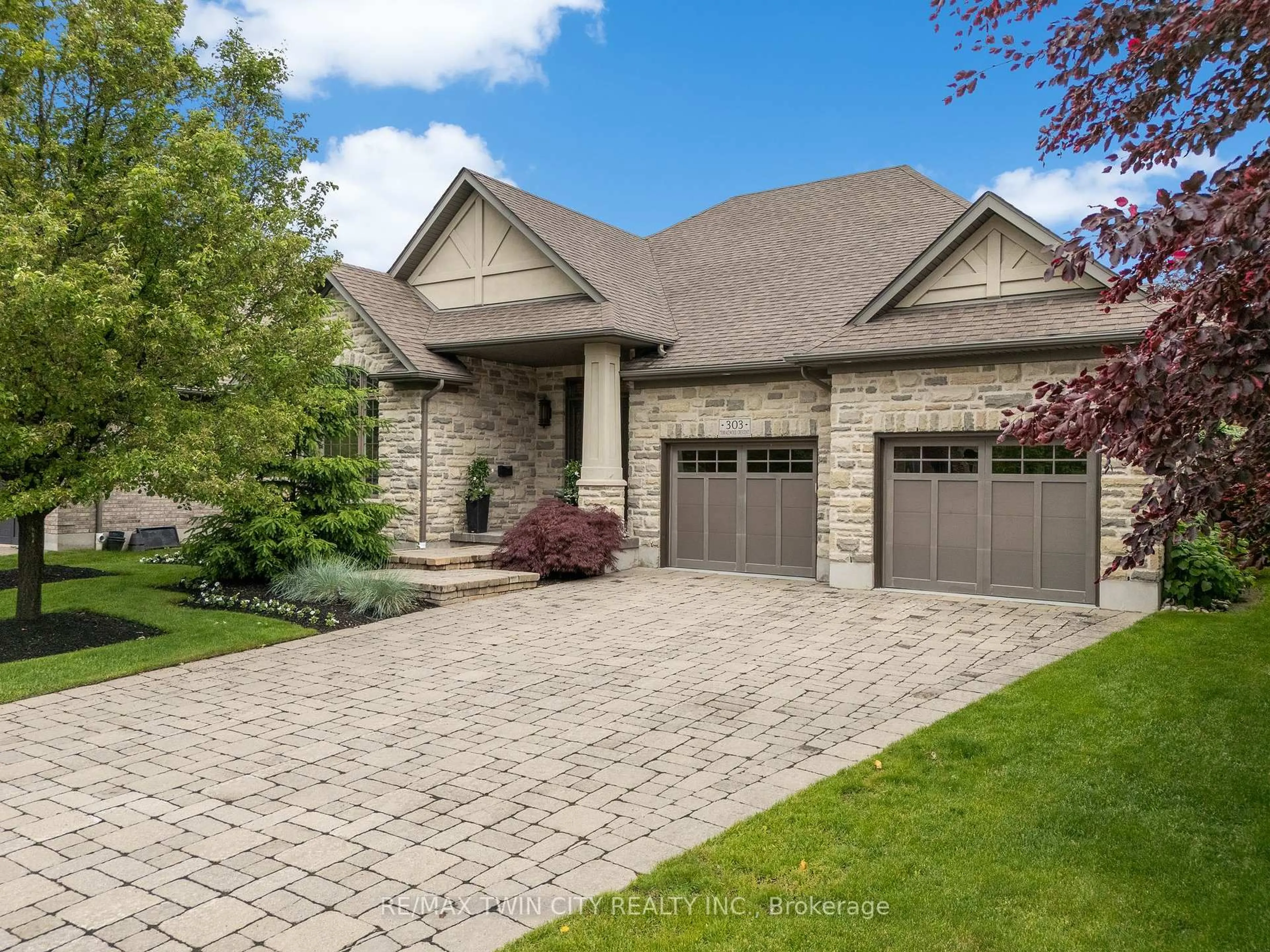 Home with brick exterior material, street for 303 Terrace Wood Cres, Kitchener Ontario N2P 0A8