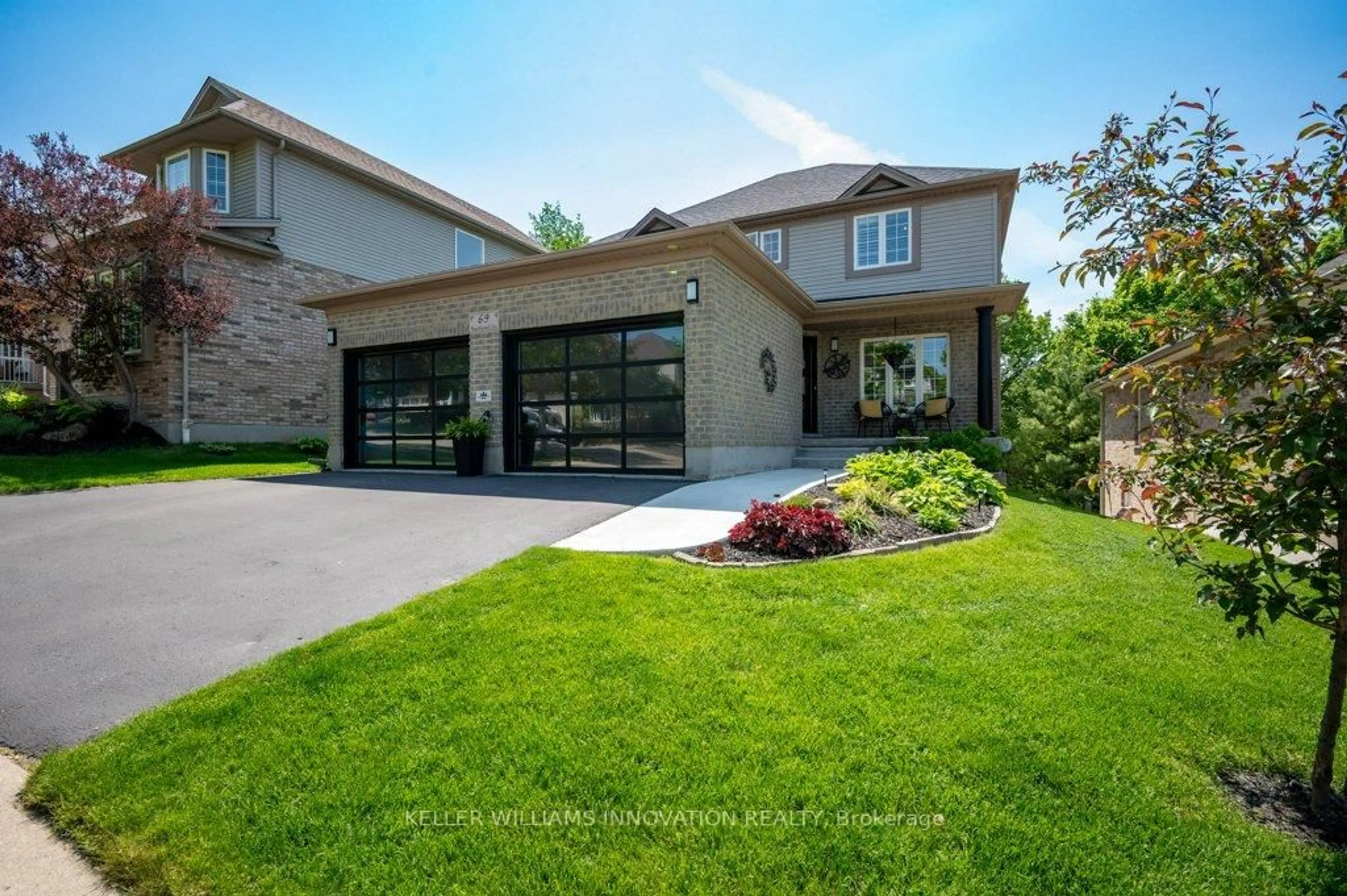 Home with brick exterior material, street for 69 Hearthwood Cres, Kitchener Ontario N2R 1K6