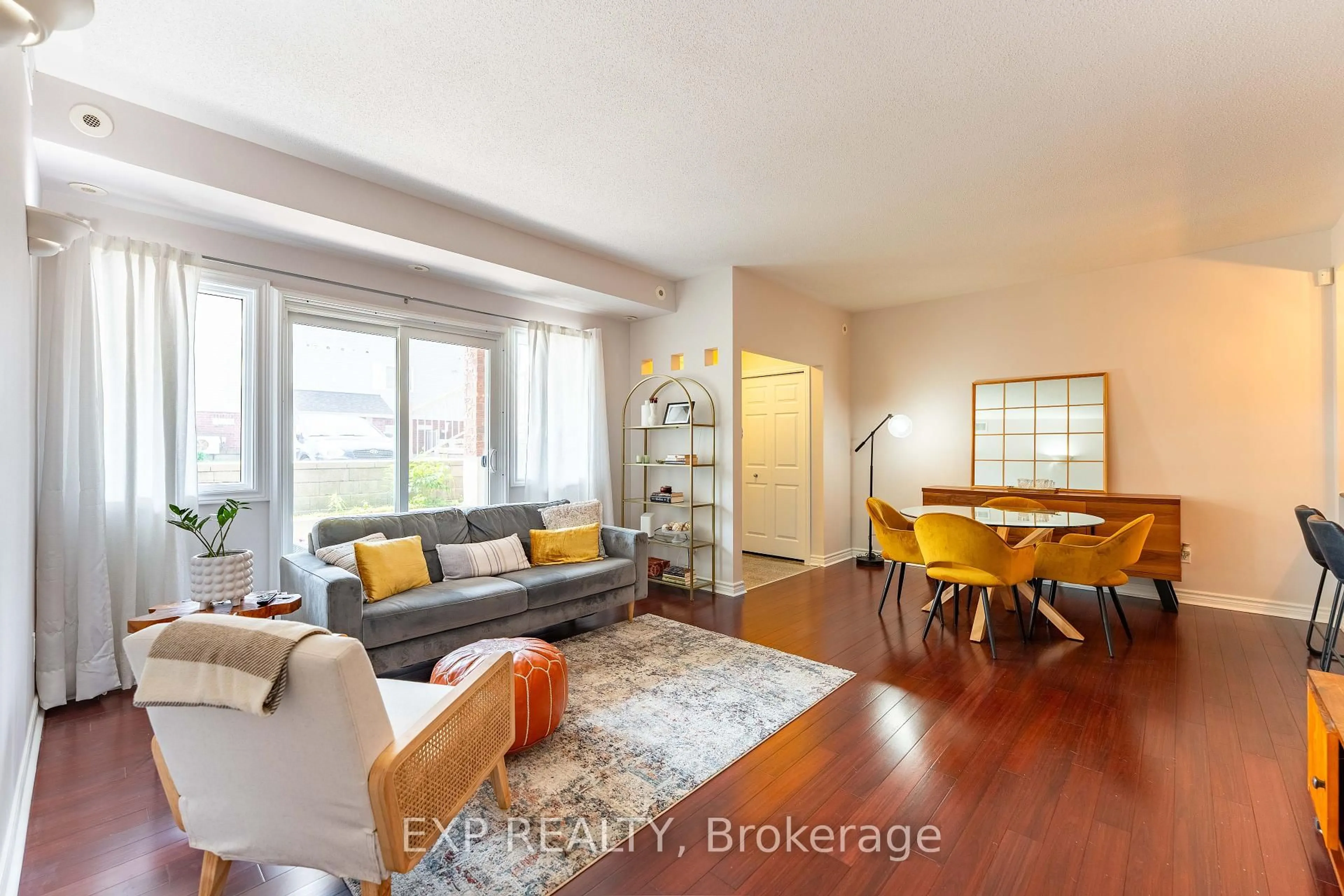 Living room with furniture, wood/laminate floor for 221 Crestway Dr #D, Ottawa Ontario K2G 0A9