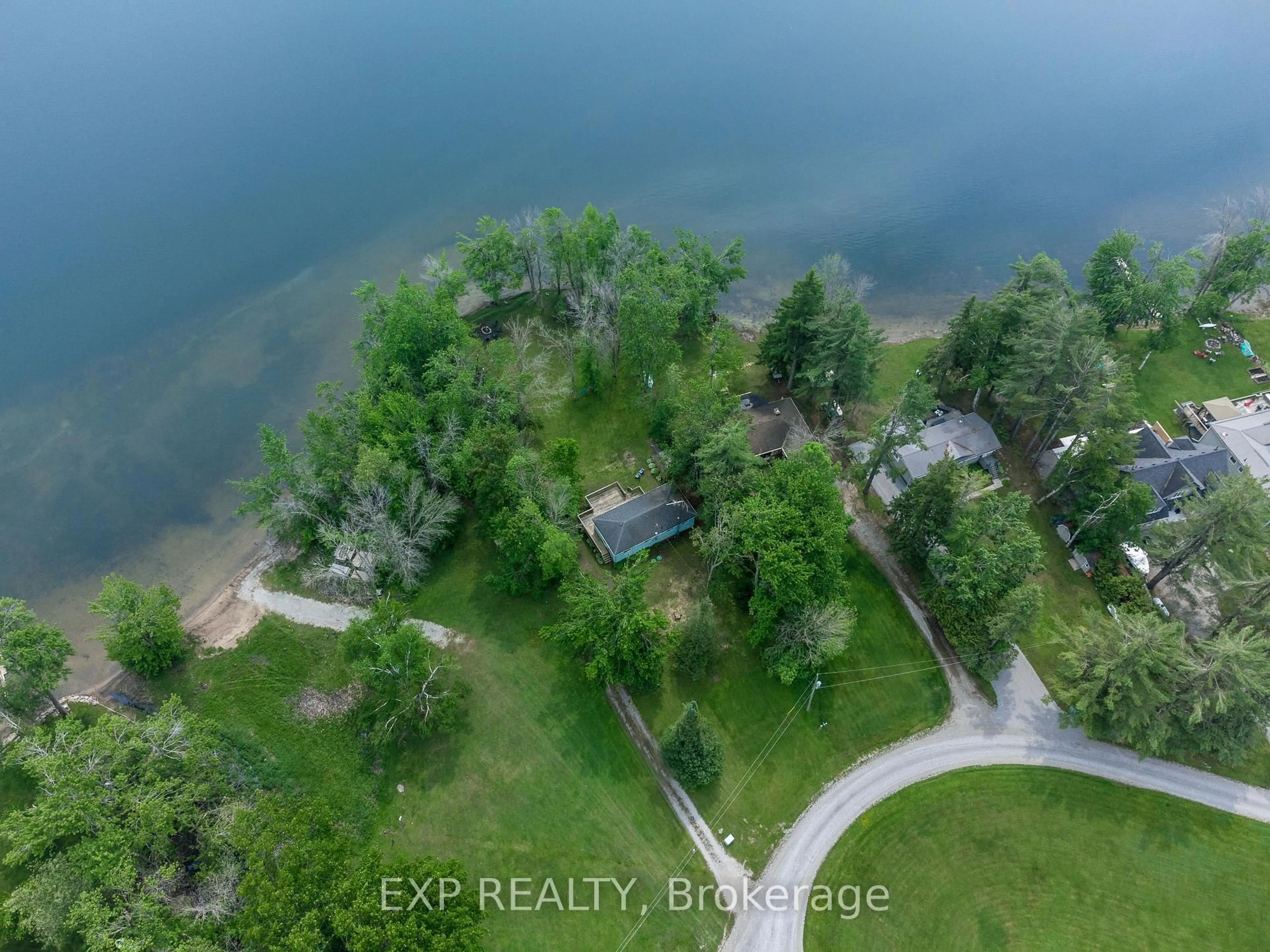 A pic from outside/outdoor area/front of a property/back of a property/a pic from drone, water/lake/river/ocean view for 28 Park Lane, Kawartha Lakes Ontario L0K 1W0