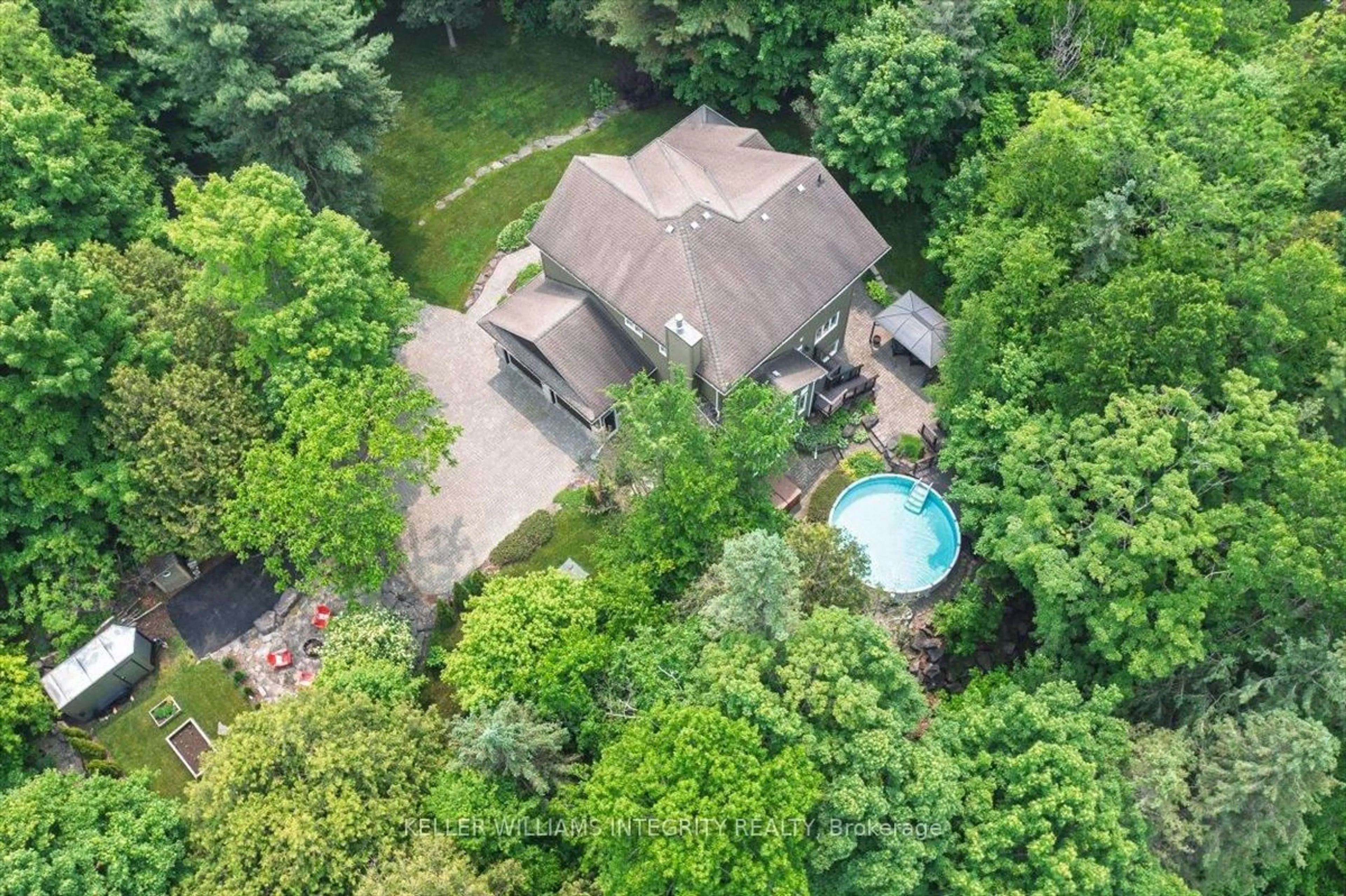 A pic from outside/outdoor area/front of a property/back of a property/a pic from drone, forest/trees view for 2390 Brennan Park Dr, Ottawa Ontario K4C 1H6