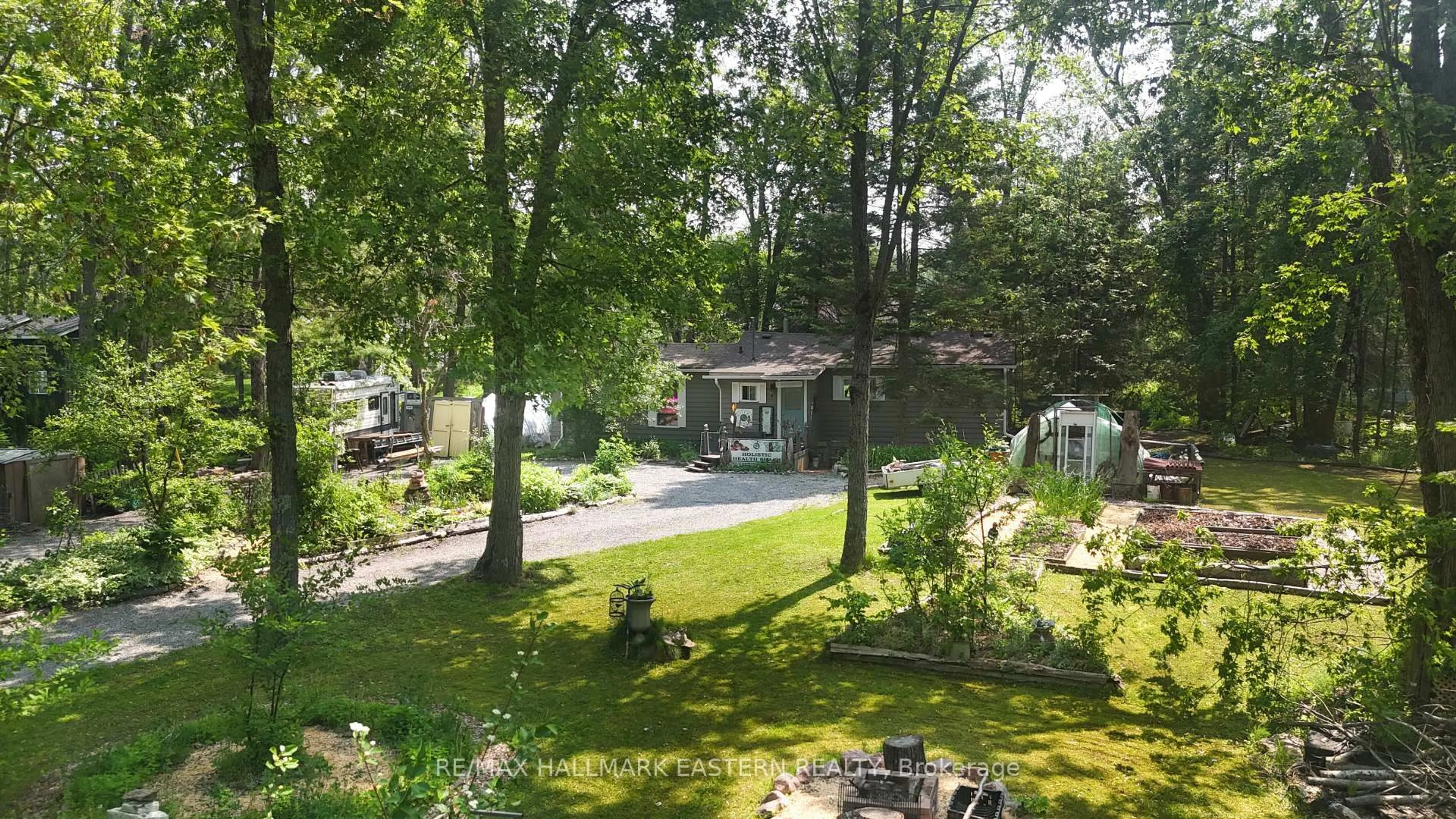 A pic from outside/outdoor area/front of a property/back of a property/a pic from drone, unknown for 55 Kennedy Dr, Trent Lakes Ontario K0M 1A0