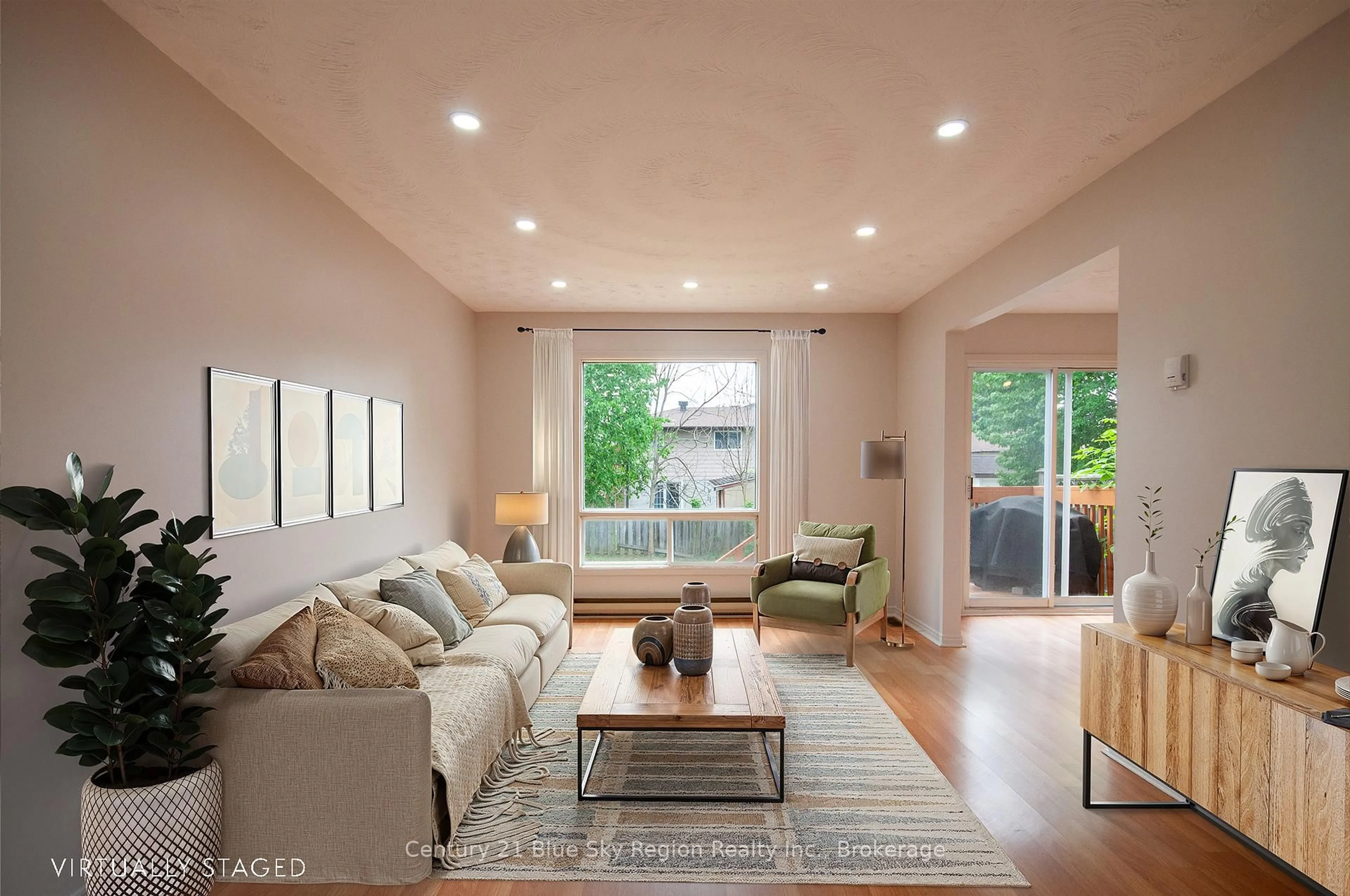 Living room with furniture, wood/laminate floor for 26 Paul St, North Bay Ontario P1B 9M1