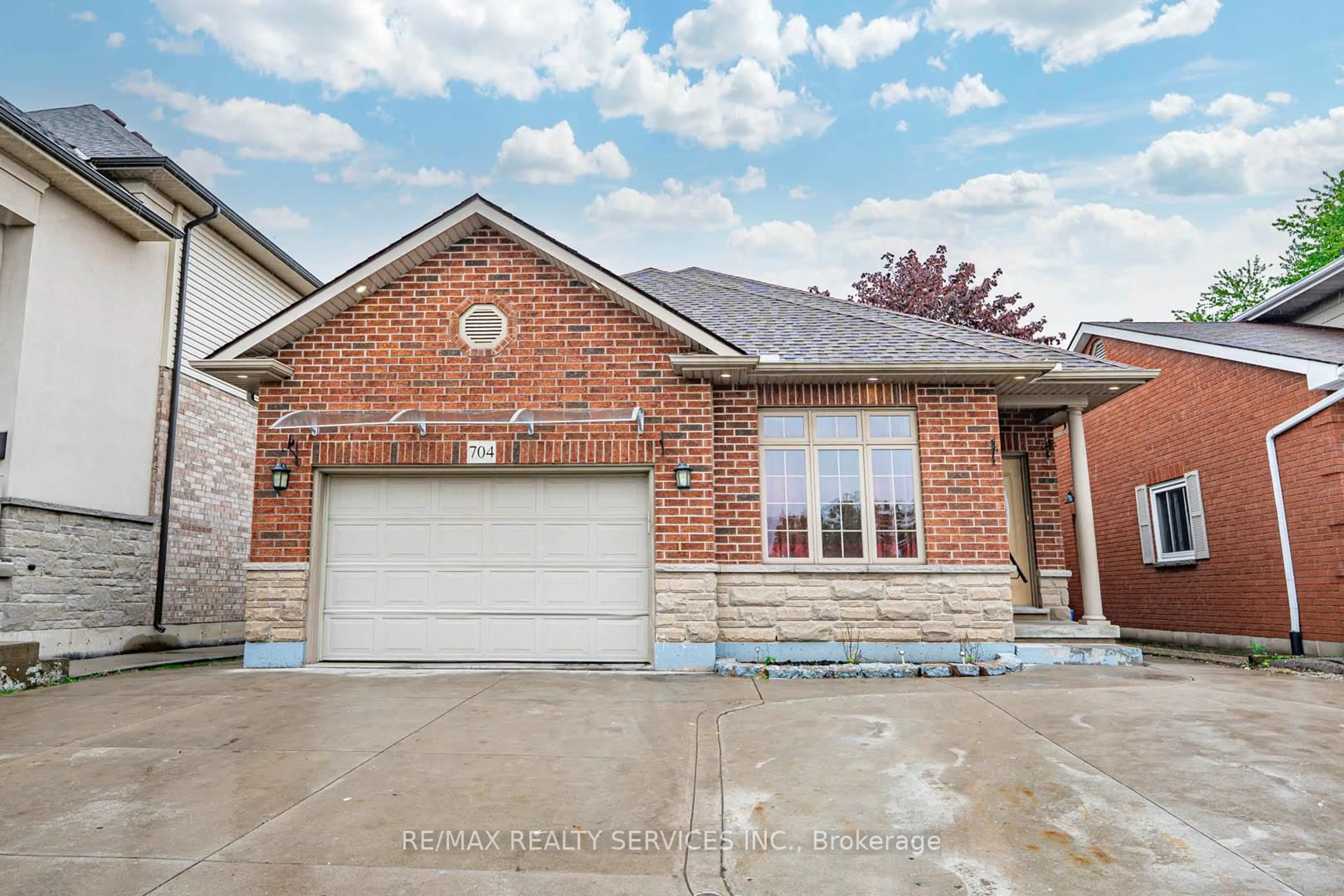 Home with brick exterior material, street for 704 Stone Church Rd, Hamilton Ontario L8W 1A7