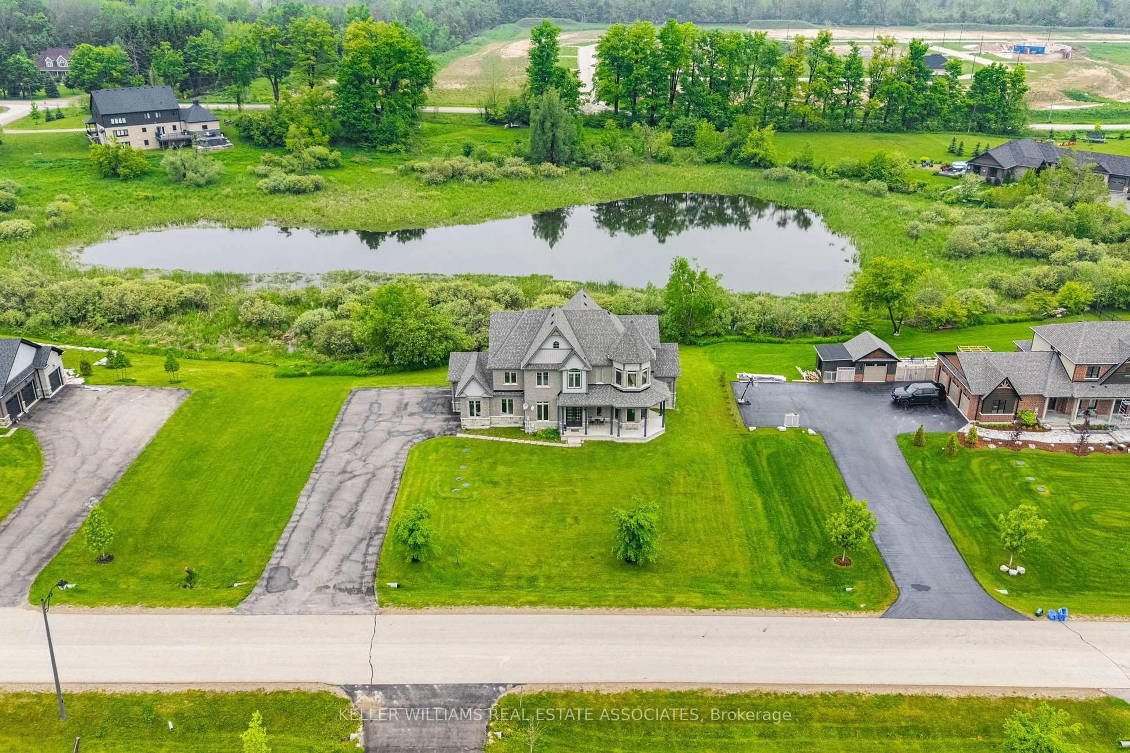 A pic from outside/outdoor area/front of a property/back of a property/a pic from drone, water/lake/river/ocean view for 7 Country Meadows Dr, Amaranth Ontario L9V 3T8