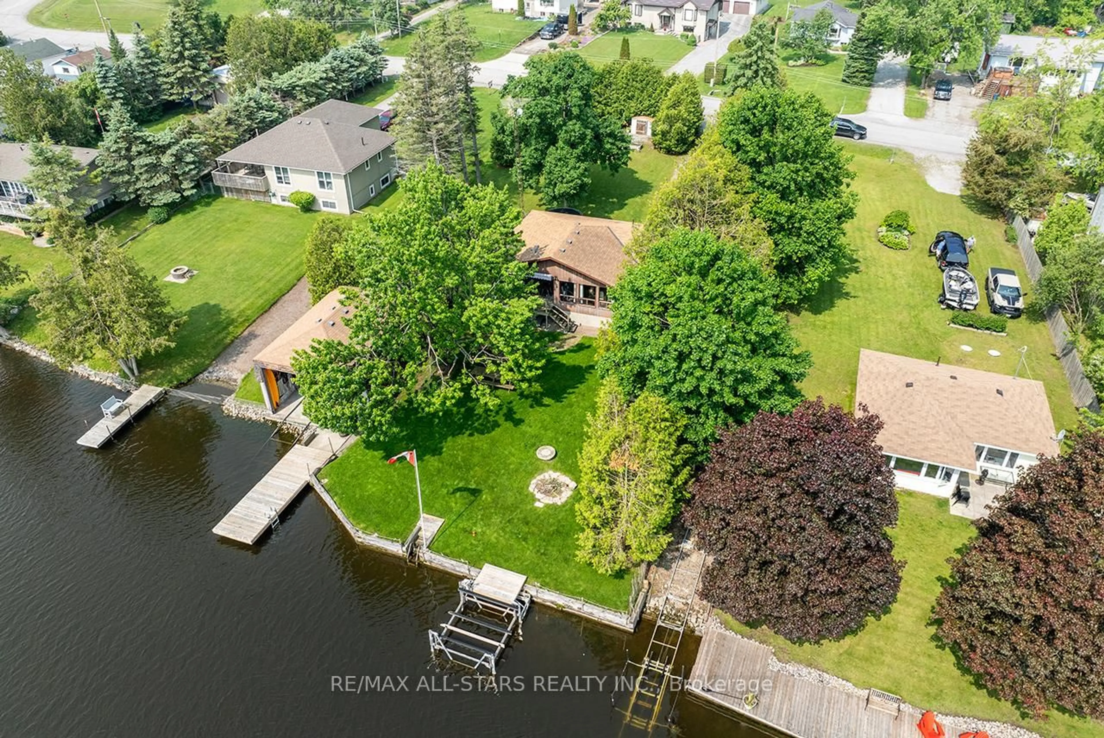 A pic from outside/outdoor area/front of a property/back of a property/a pic from drone, water/lake/river/ocean view for 38 Riverside Dr, Kawartha Lakes Ontario K9V 0H6