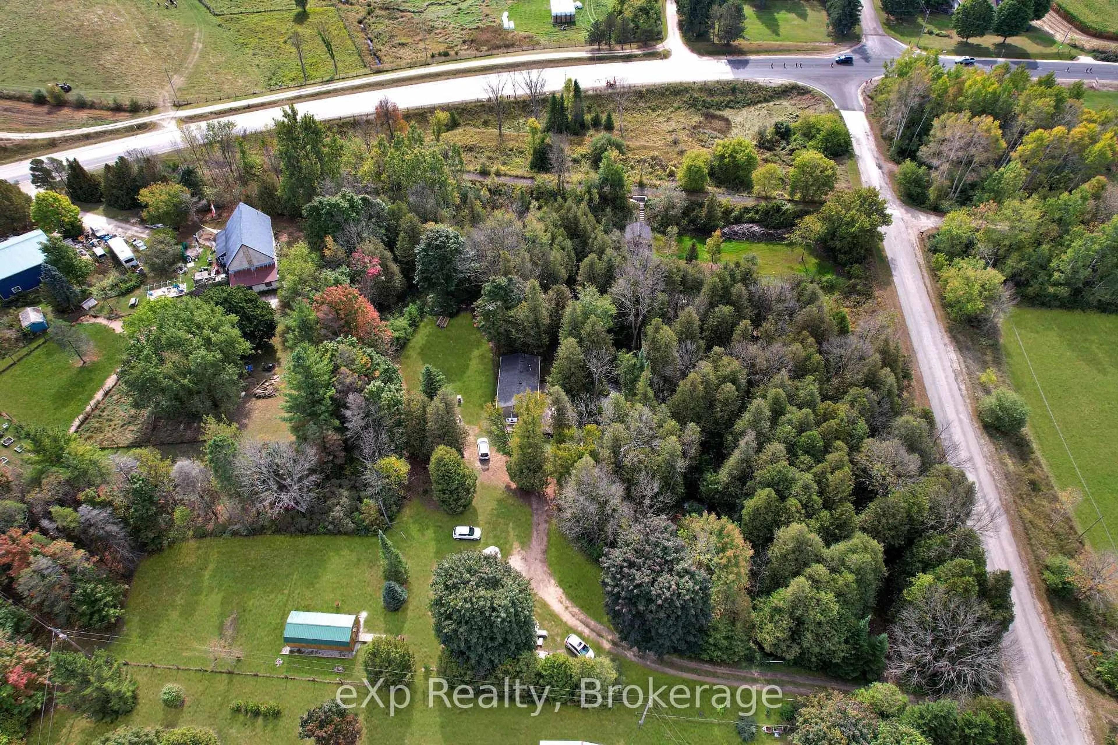 A pic from outside/outdoor area/front of a property/back of a property/a pic from drone, forest/trees view for 119 Old Bridge Rd, West Grey Ontario N4N 3B8