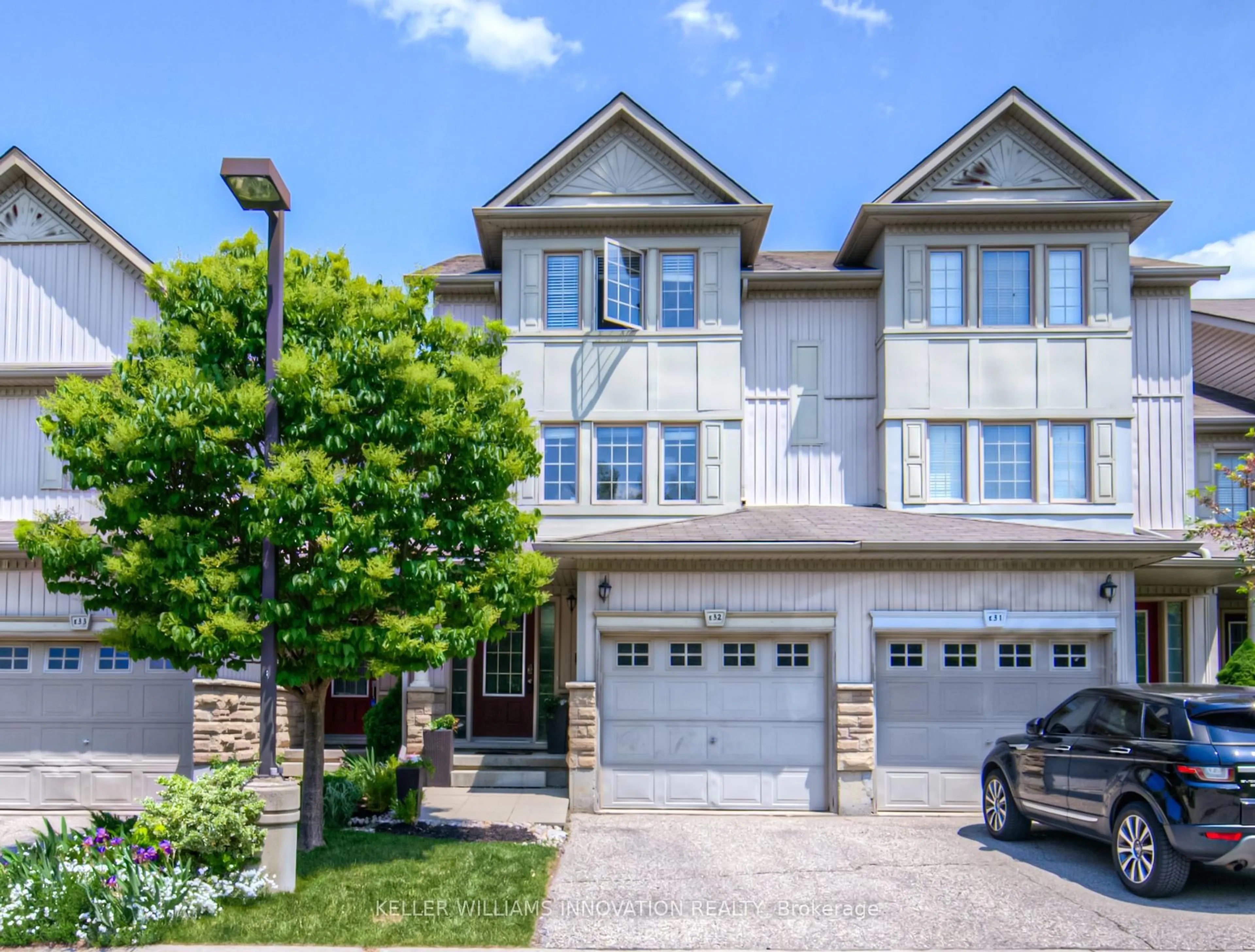 Home with brick exterior material, street for 85 Bankside Dr #E32, Kitchener Ontario N2N 3M4