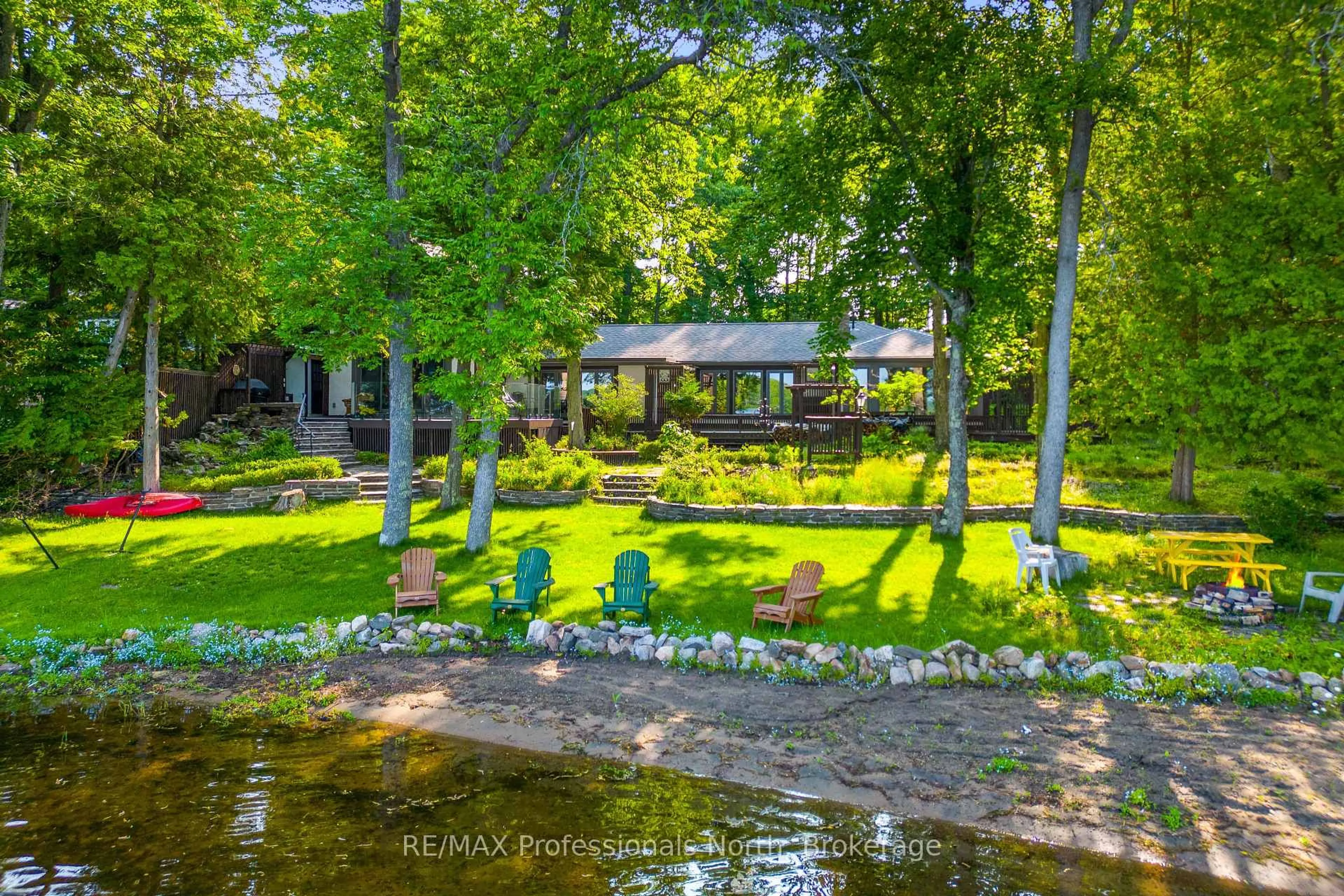 A pic from outside/outdoor area/front of a property/back of a property/a pic from drone, water/lake/river/ocean view for 1073 Grass Lake Rd, Dysart et al Ontario K0M 1S0