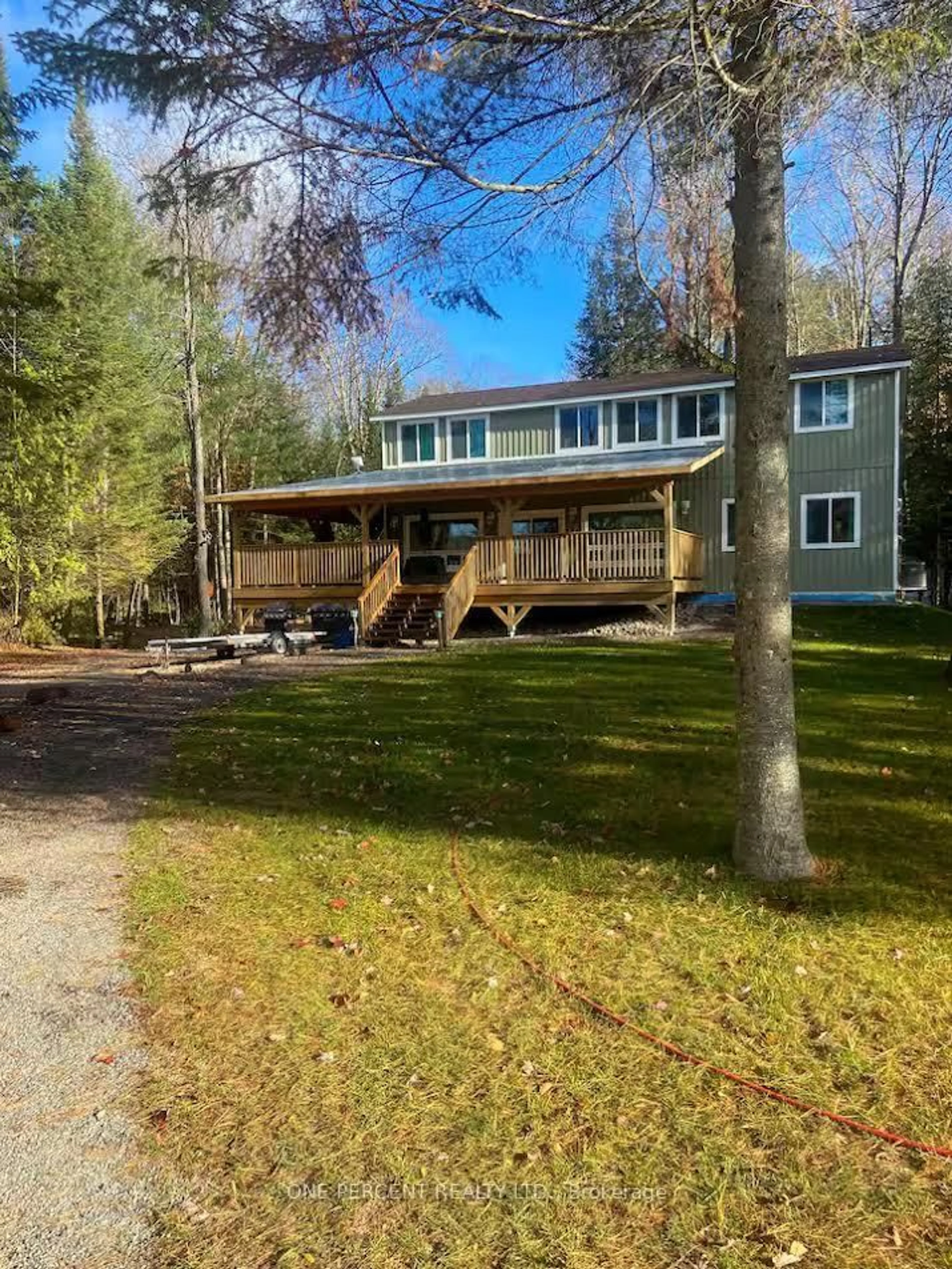 A pic from outside/outdoor area/front of a property/back of a property/a pic from drone, water/lake/river/ocean view for 1013 Goodlife Lane, Algonquin Highlands Ontario P0A 1E0