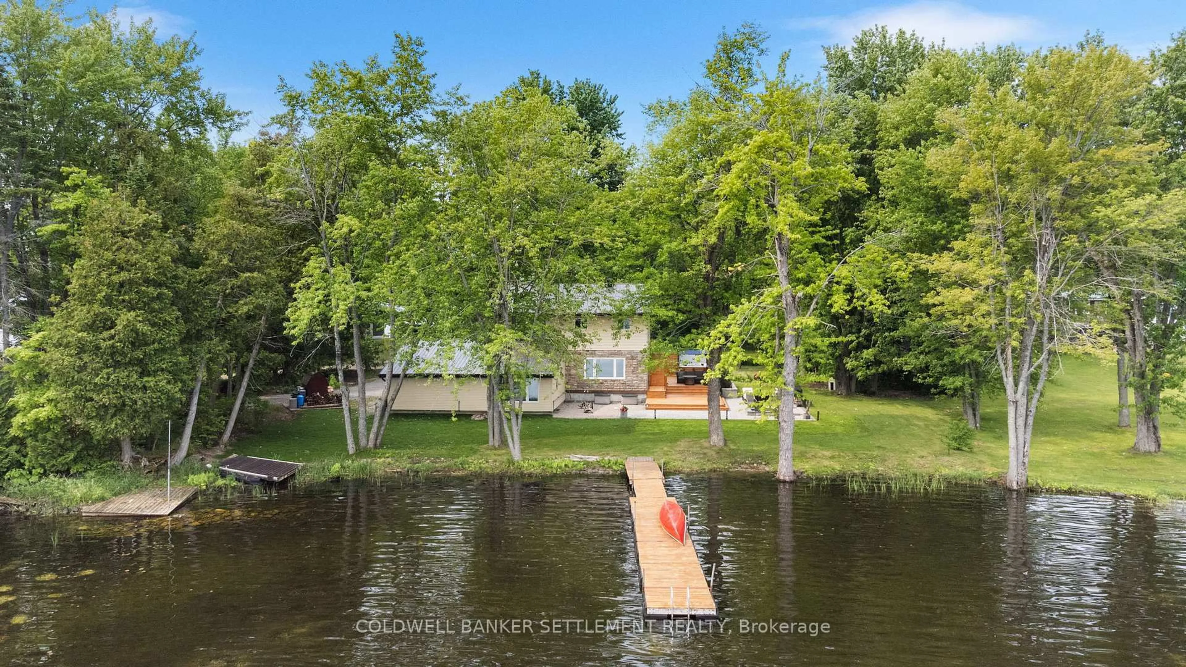 A pic from outside/outdoor area/front of a property/back of a property/a pic from drone, water/lake/river/ocean view for 1021 Trillium Point Rd, Sharbot Lake Ontario K0H 2P0
